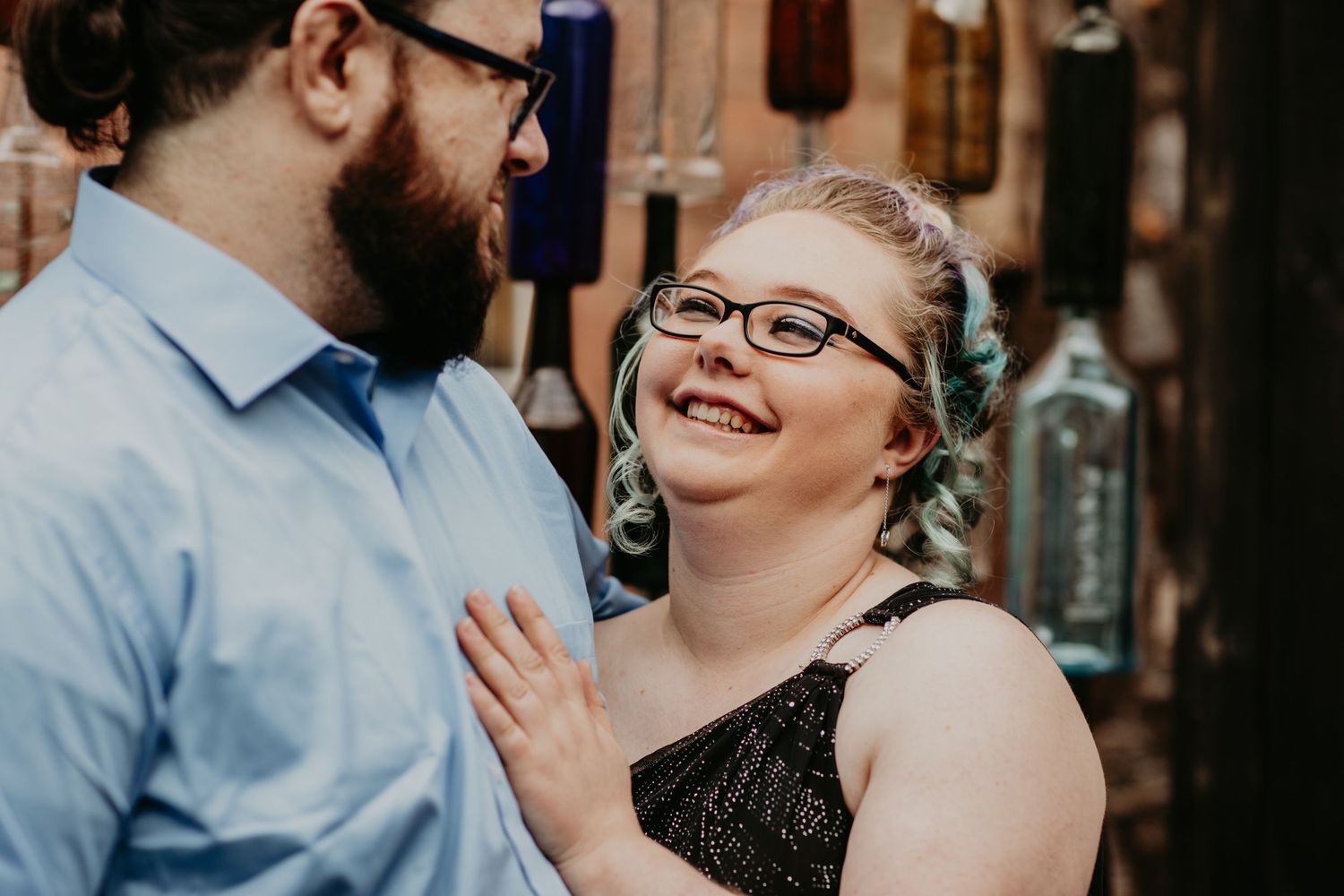 A happy couple shares a candid moment together at a bar or restaurant.