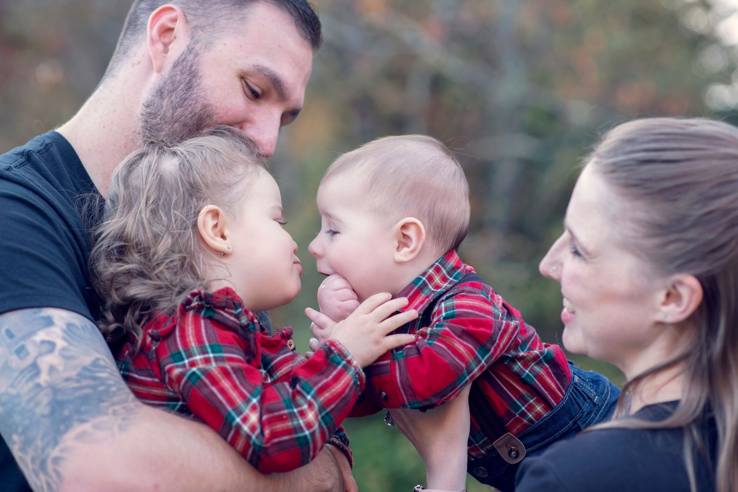 A series of intimate family photos showing tender moments between parents and children in outdoor settings.