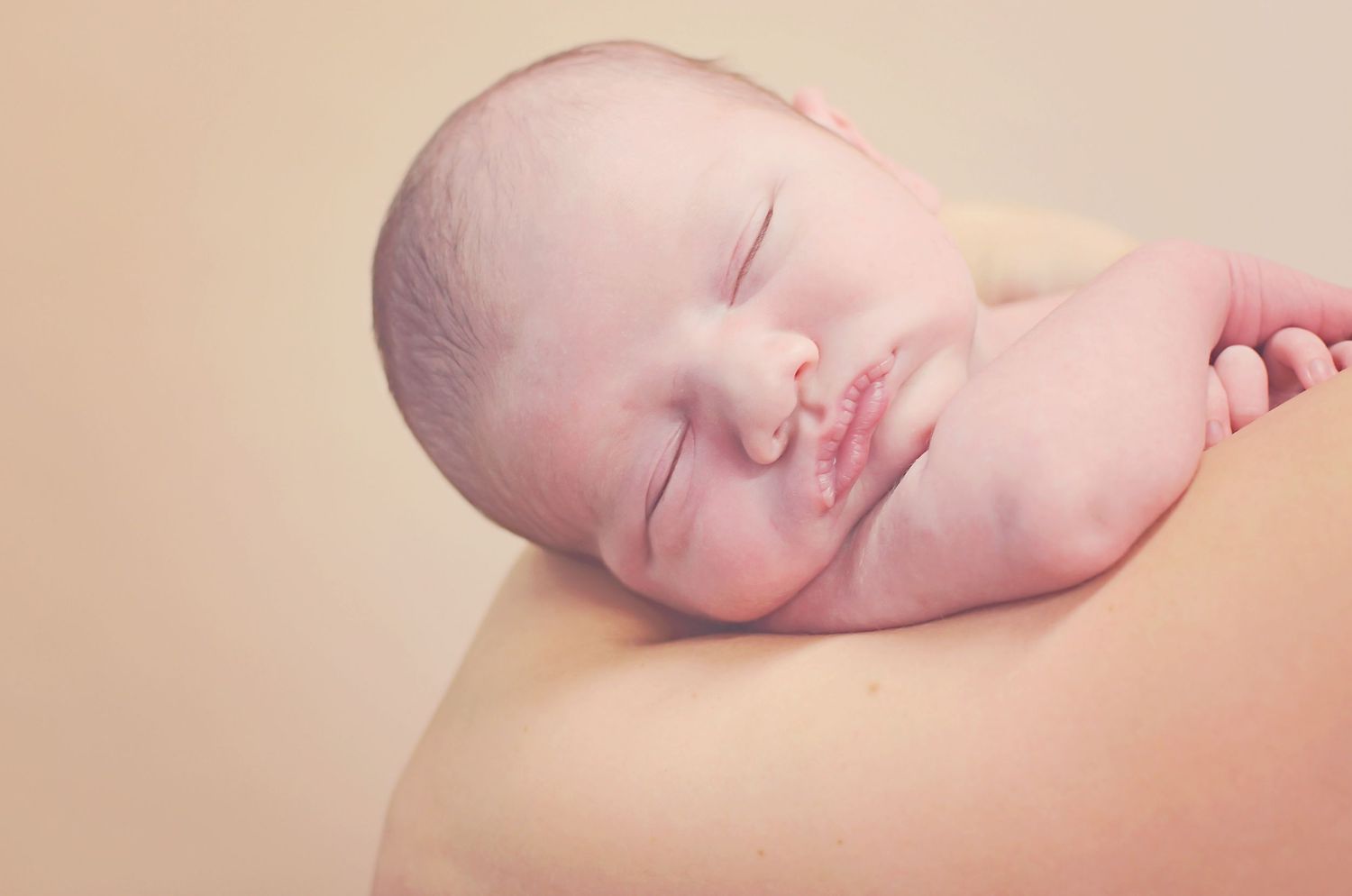 A collection of newborn baby body detail photos showing tiny feet, fingers, and facial features in soft natural light.