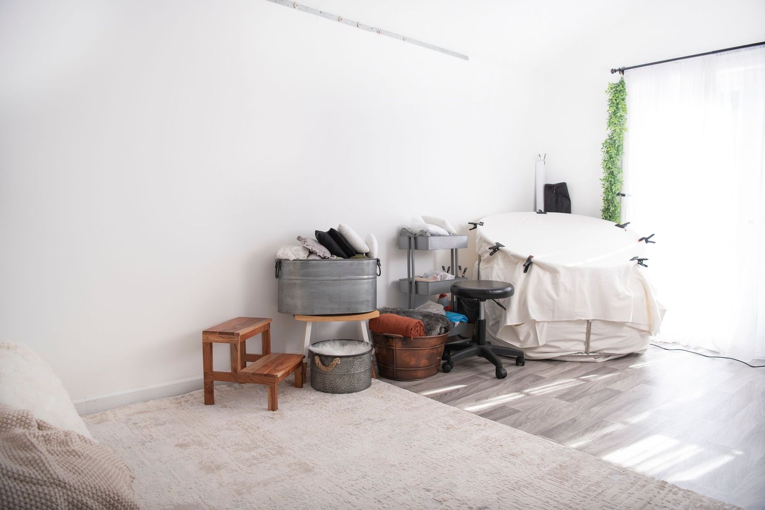 Cozy photography studio in Exeter, Rhode Island featuring soft seating ,neutral decor and warm textures Rhode Island Photographer