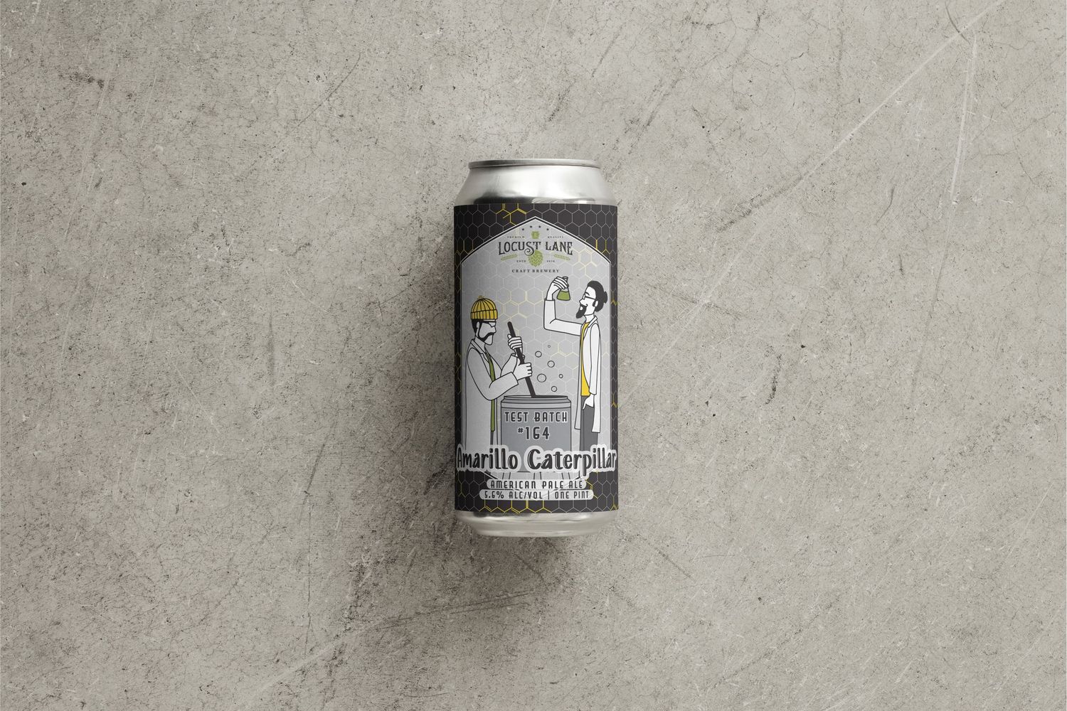 Image of a beer can featuring an illustration of two people in lab coats using brewing equipment to make a Test Batch on a black background.