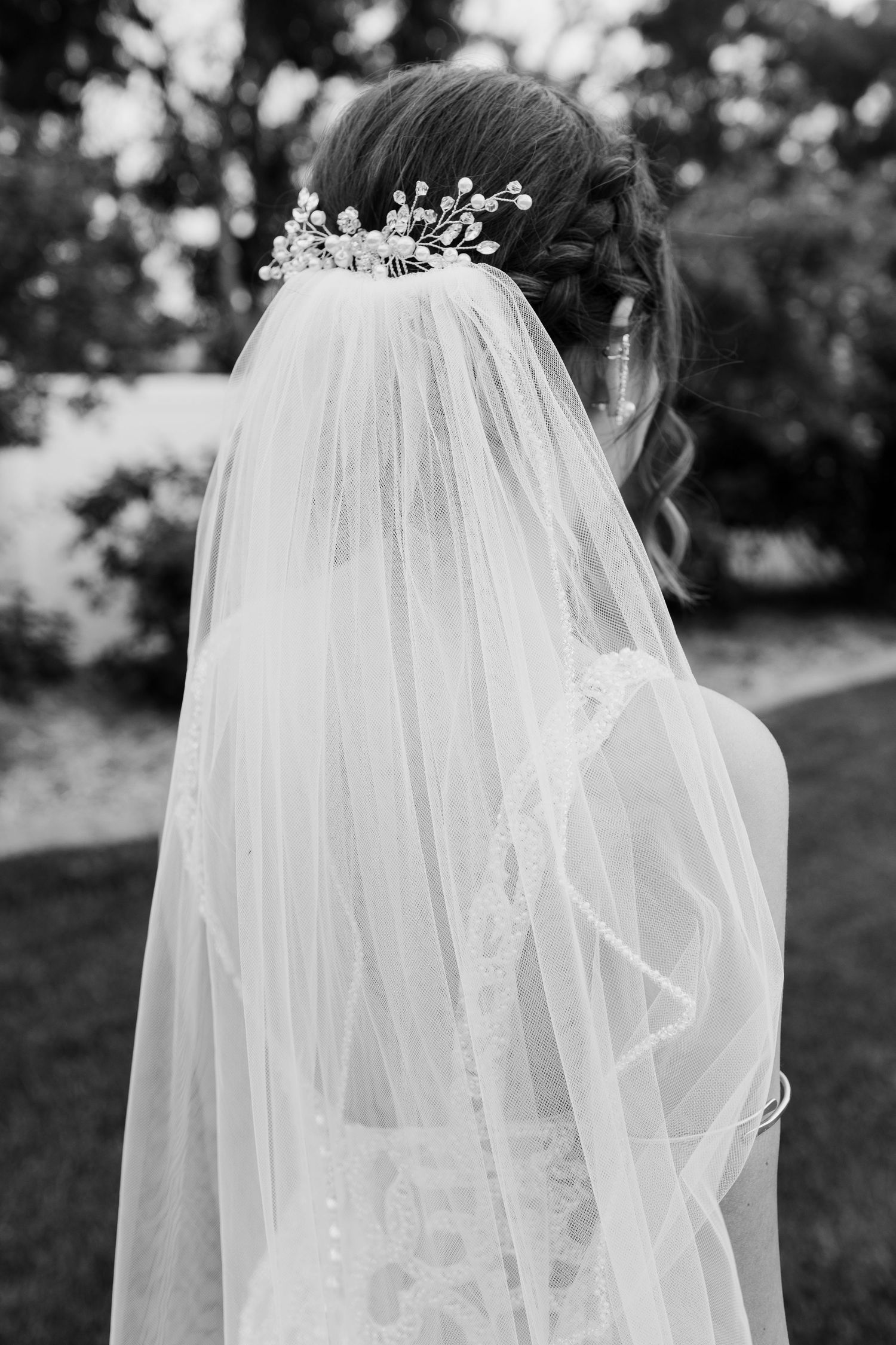 Artistic shots of delicate bridal veil and crystal hairpiece from multiple angles.