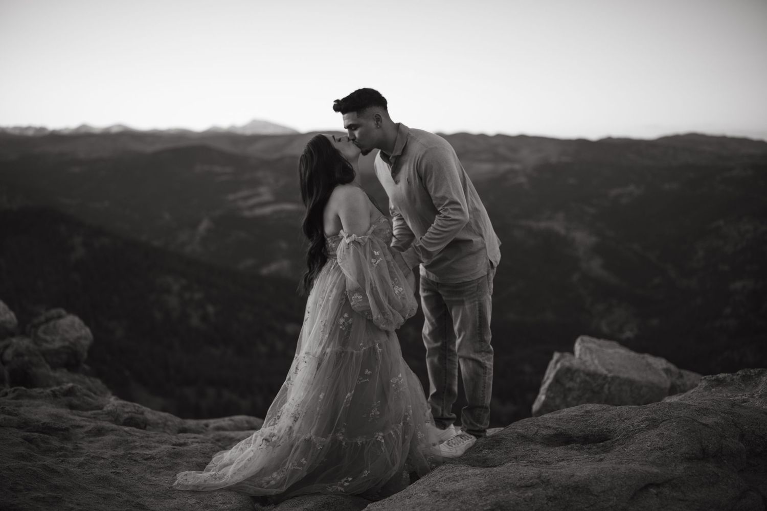 Dramatic black and white couples portrait session on mountain overlook.