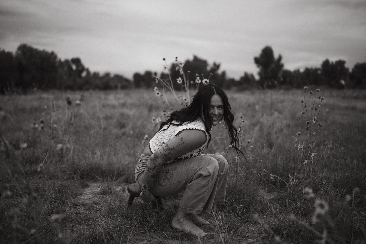 Artistic black and white sequence showing expressive movement in a natural outdoor setting.