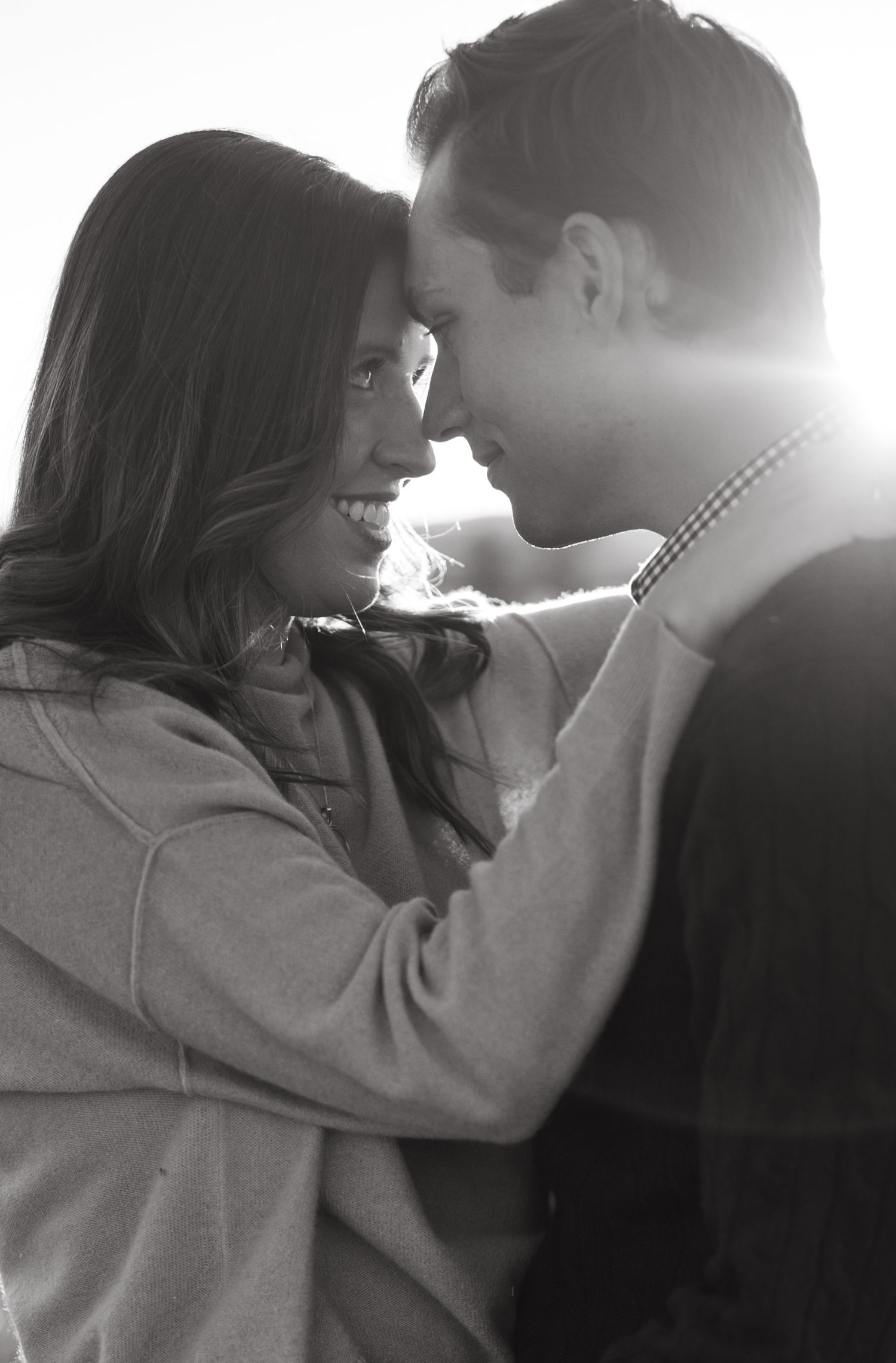 Romantic sunset portrait with warm backlighting and soft focus.