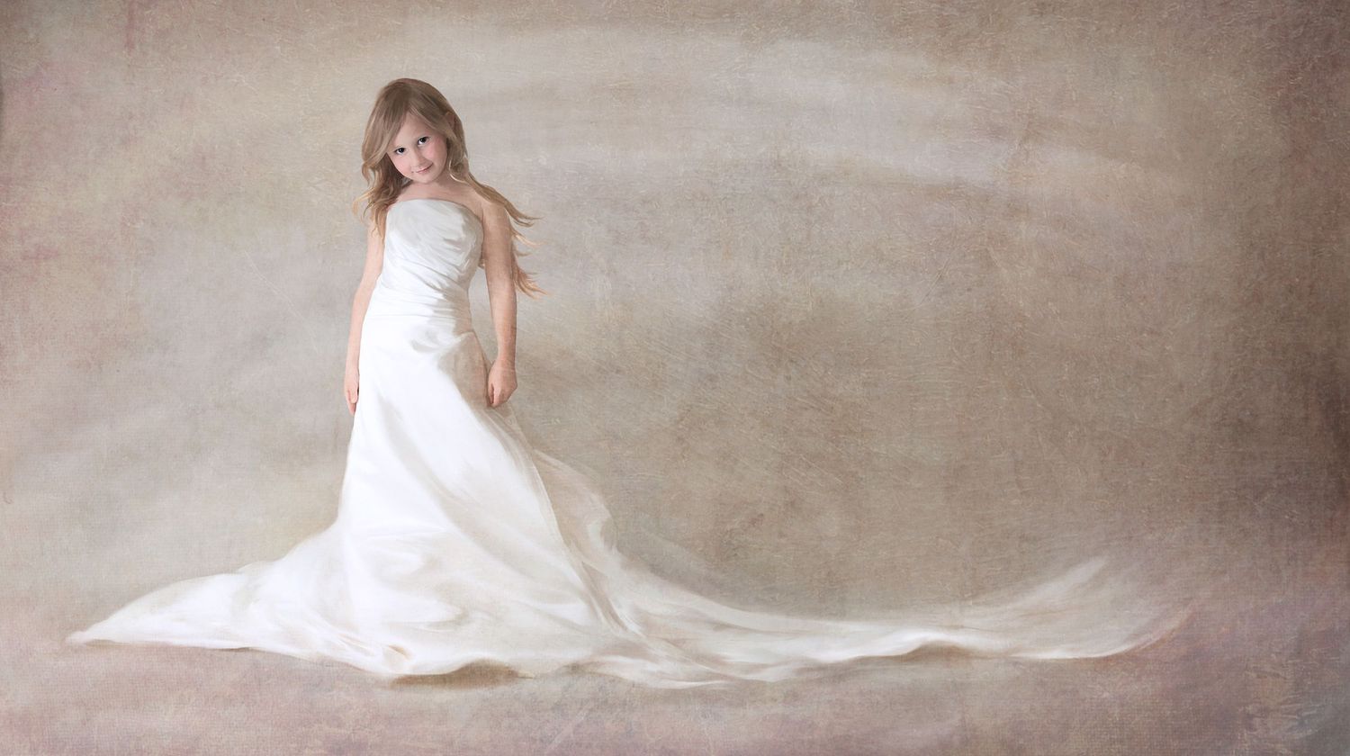 Ethereal bridal portrait featuring a flowing white wedding dress against a textured neutral background.