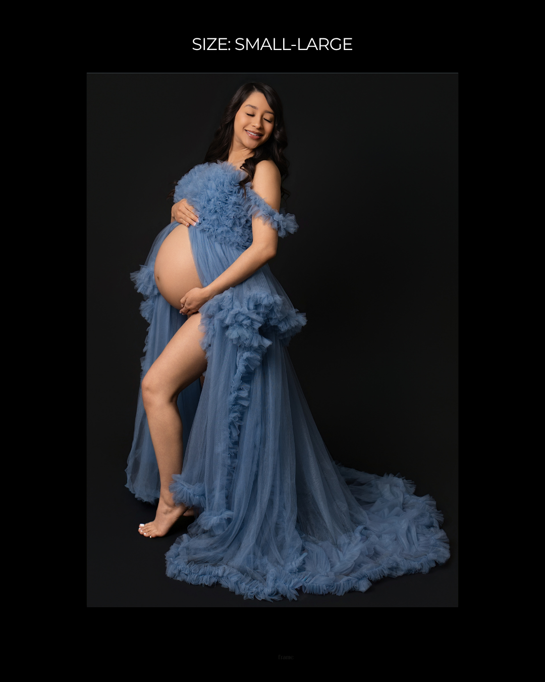 Pregnant woman in blue ruffled tulle maternity gown, size small-large, posing against black background.