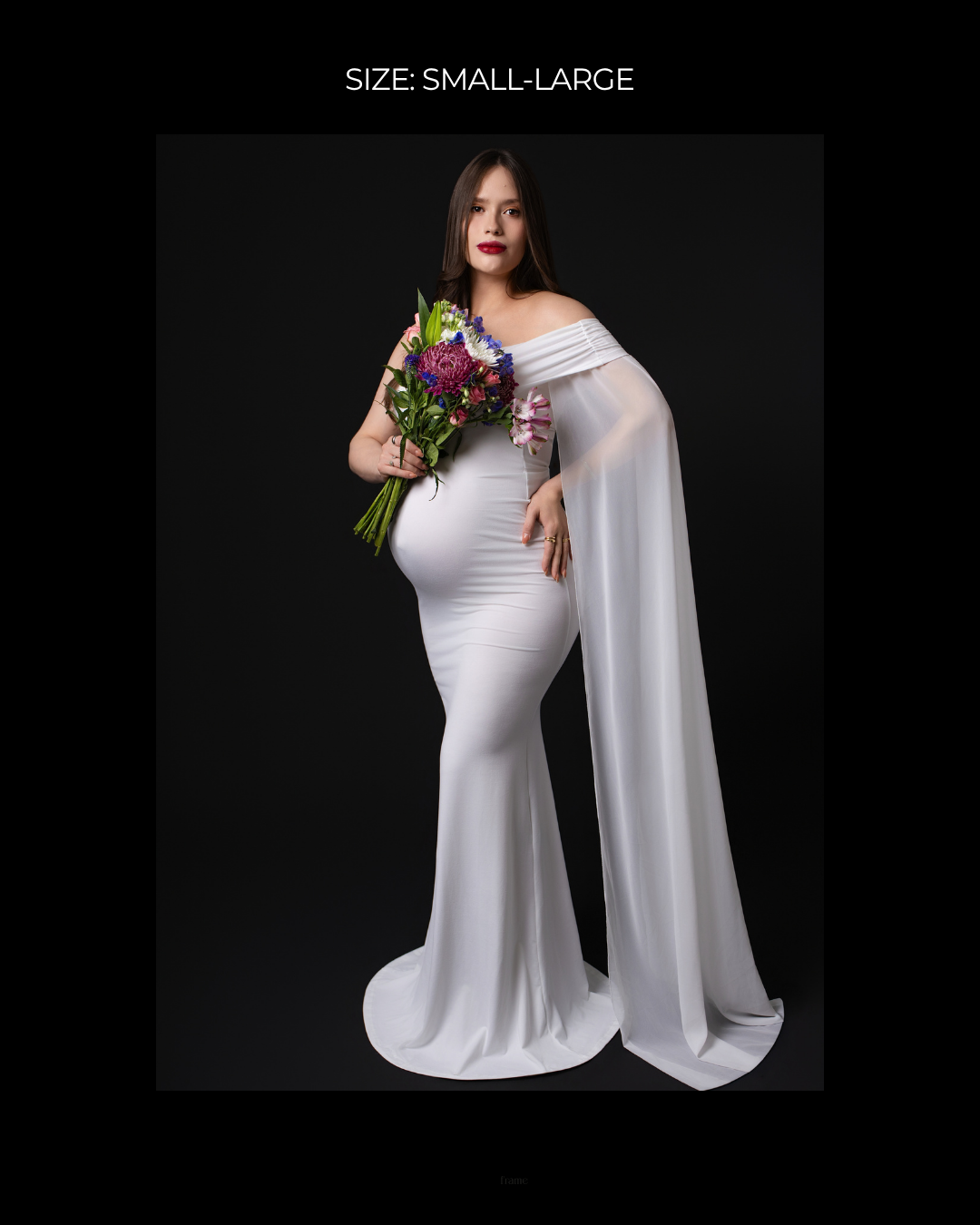 Pregnant woman in white off-shoulder mermaid gown with sheer cape, holding colorful bouquet, size small-large.