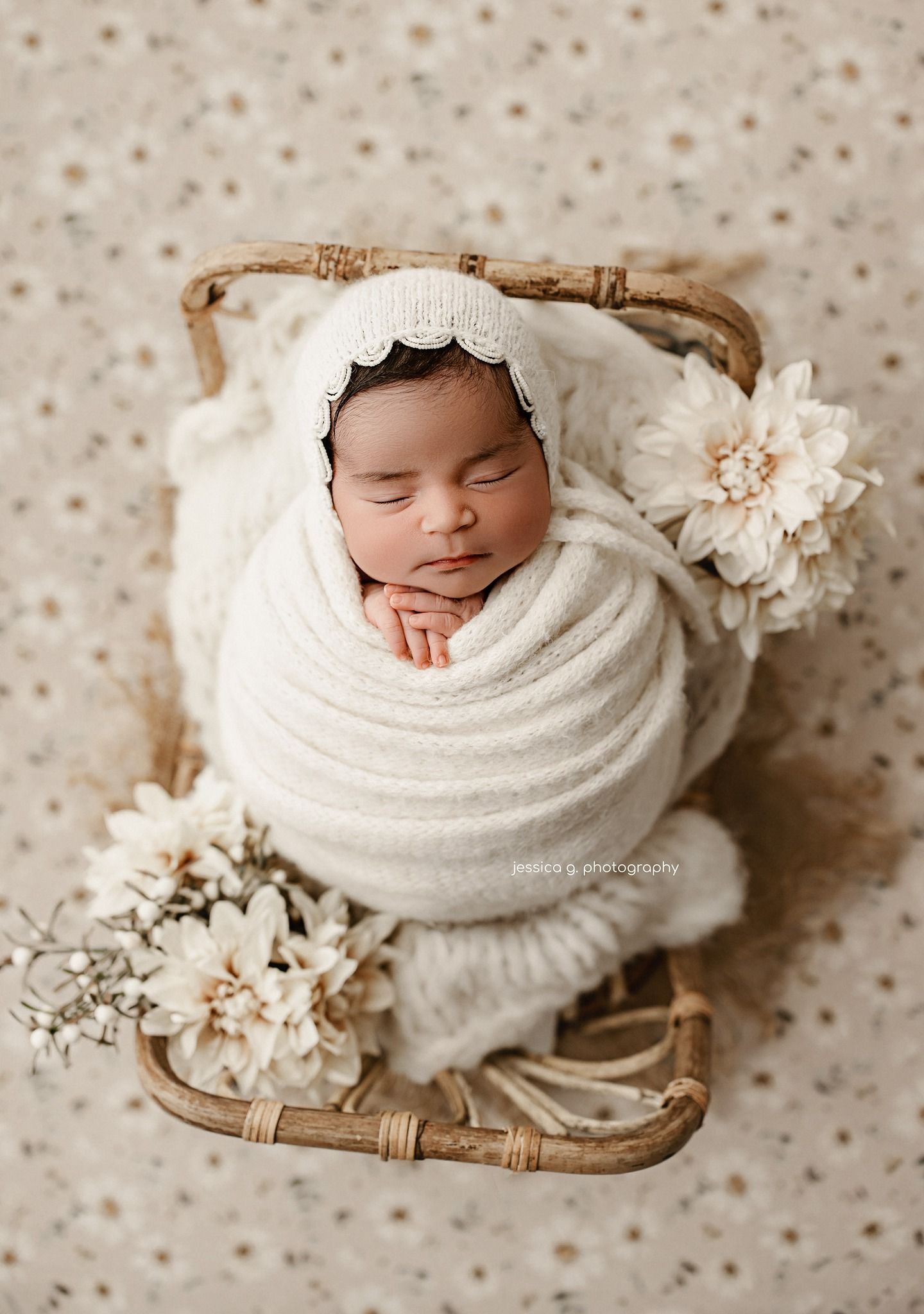 Newborn photography collage with white wrap and delicate floral accents on neutral polka dot background.