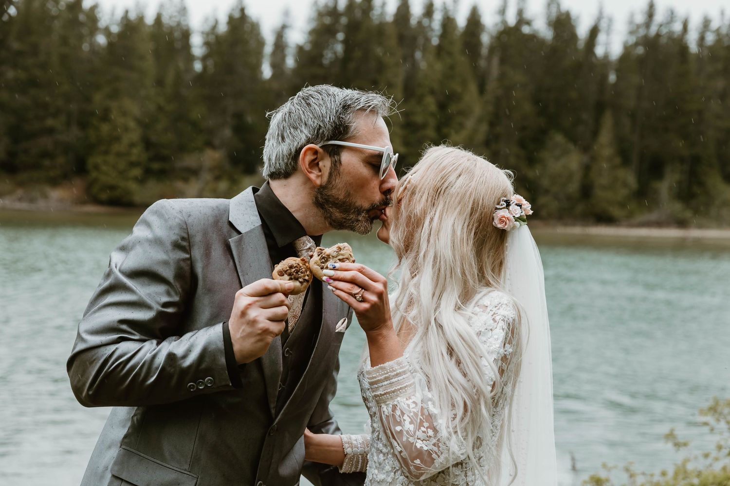 Wedding couple shares intimate moments by a serene lake surrounded by evergreen forest in five romantic photos.