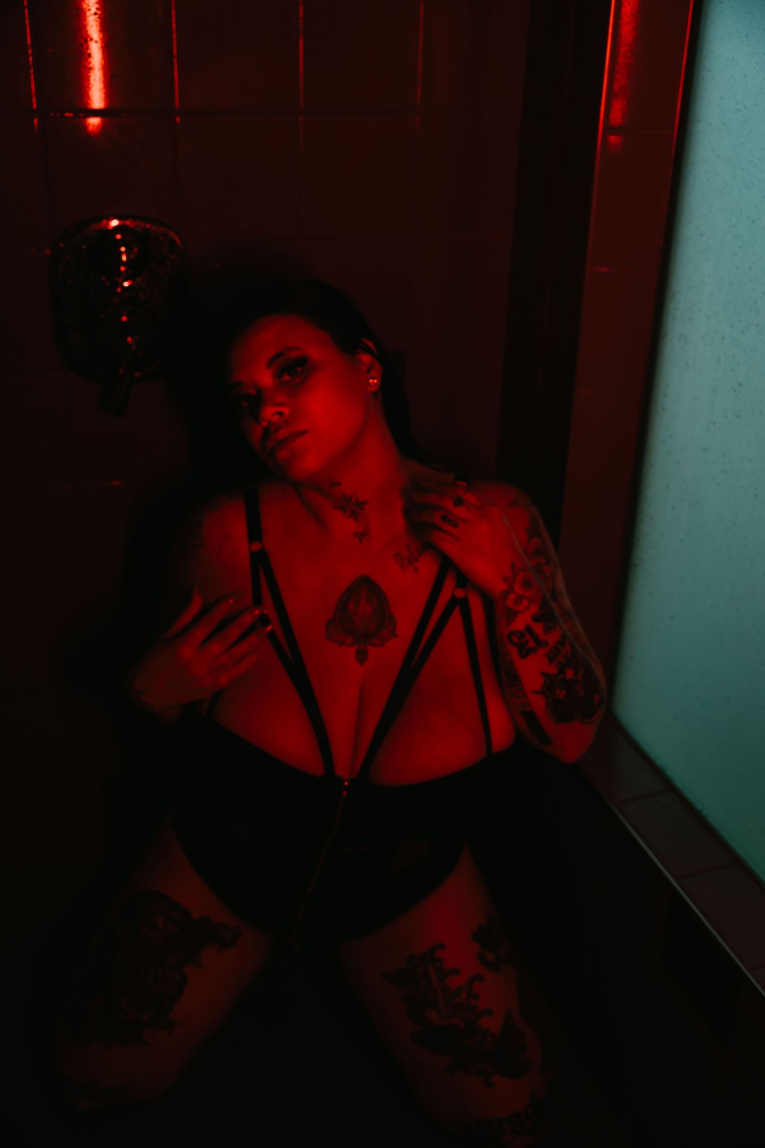 Dark hallway illuminated by eerie red lighting creates a spooky horror movie atmosphere.