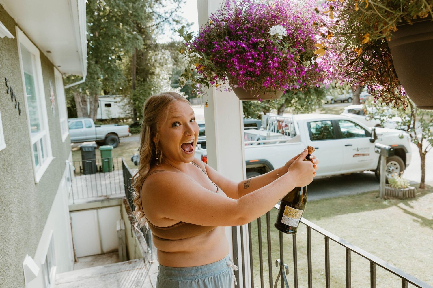 Candid moment on porch with bright pink bougainvillea flowers.