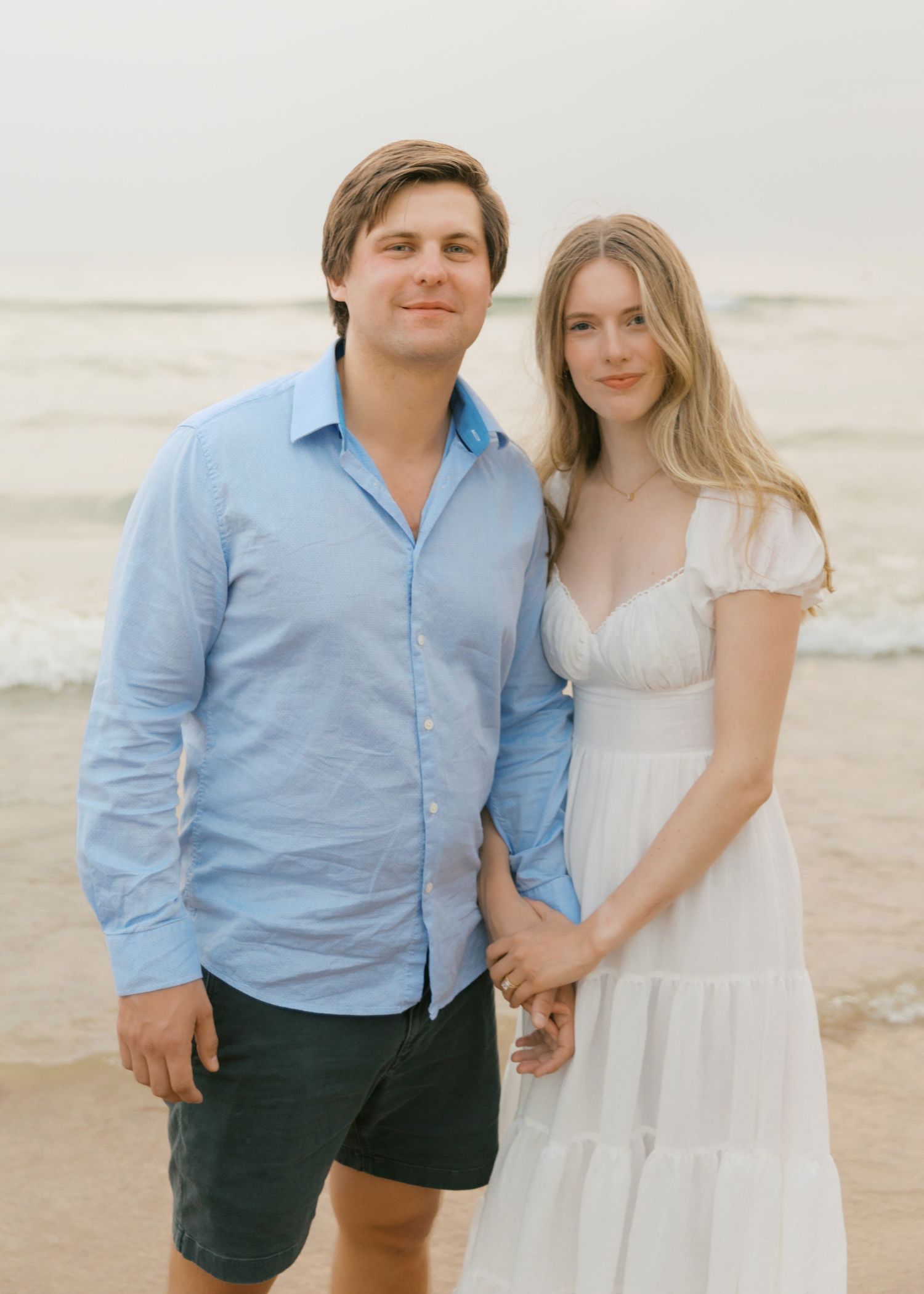 Grand Haven beach and boardwalk coastal midwest town on lake michigan engagement pictures during the summer Grand Haven Wedding photographer
