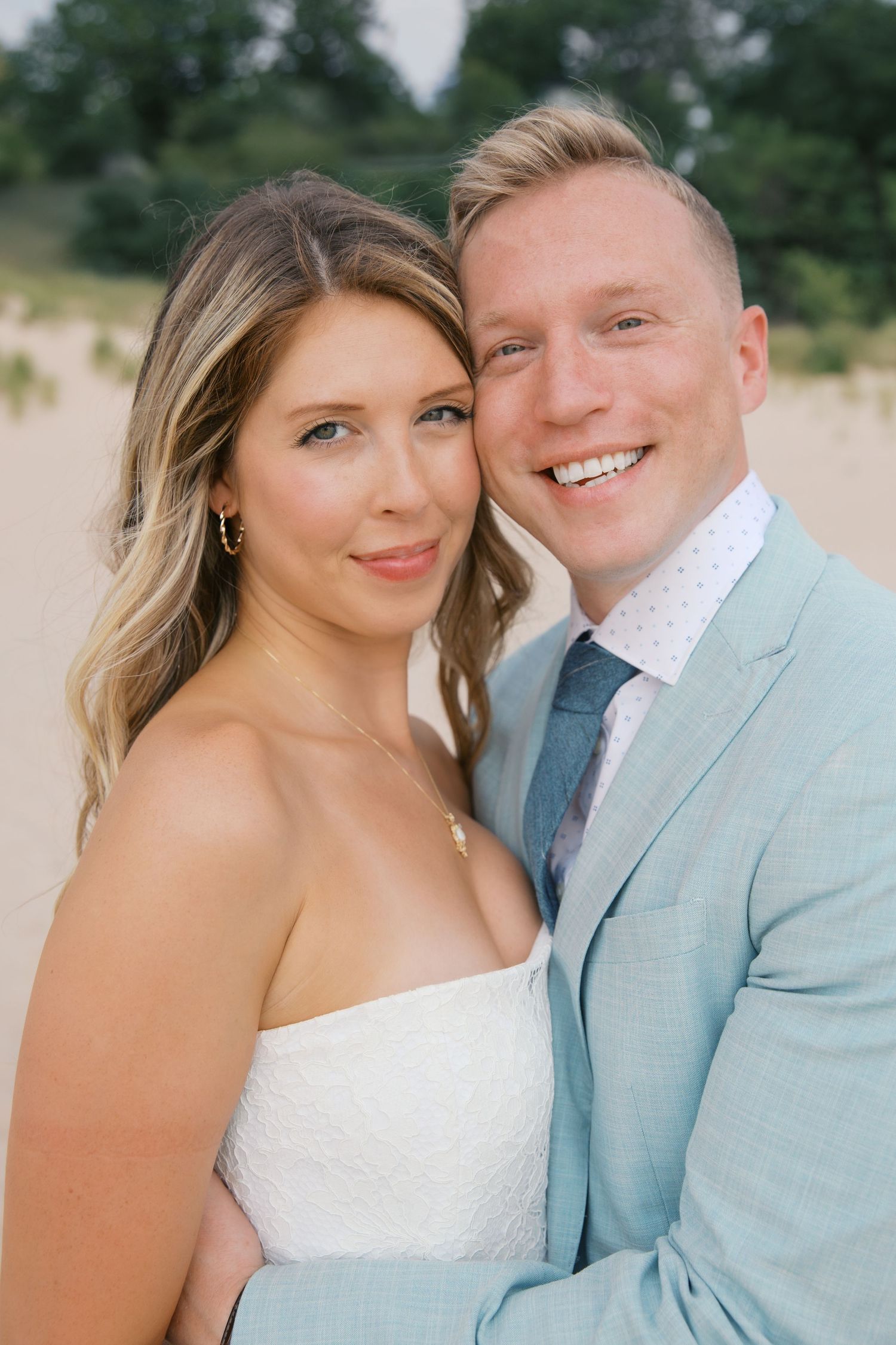Grand Haven Michigan Elopement Photography at Grand Haven City Beach on Lake Michigan. Coastal summer elopement. From, Rayna Photography