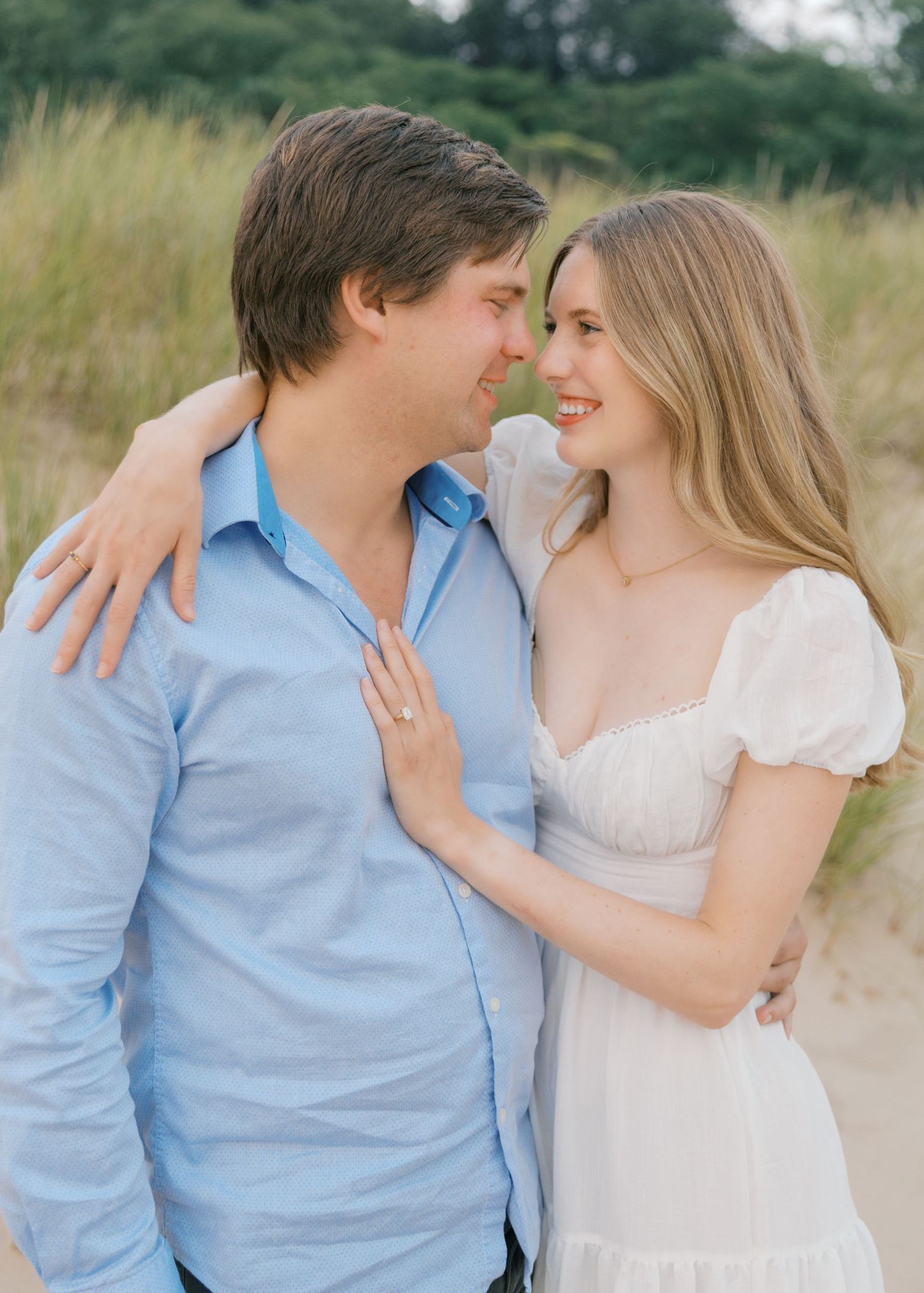 Grand Haven beach and boardwalk coastal midwest town on lake michigan engagement pictures during the summer Grand Haven Wedding photographer