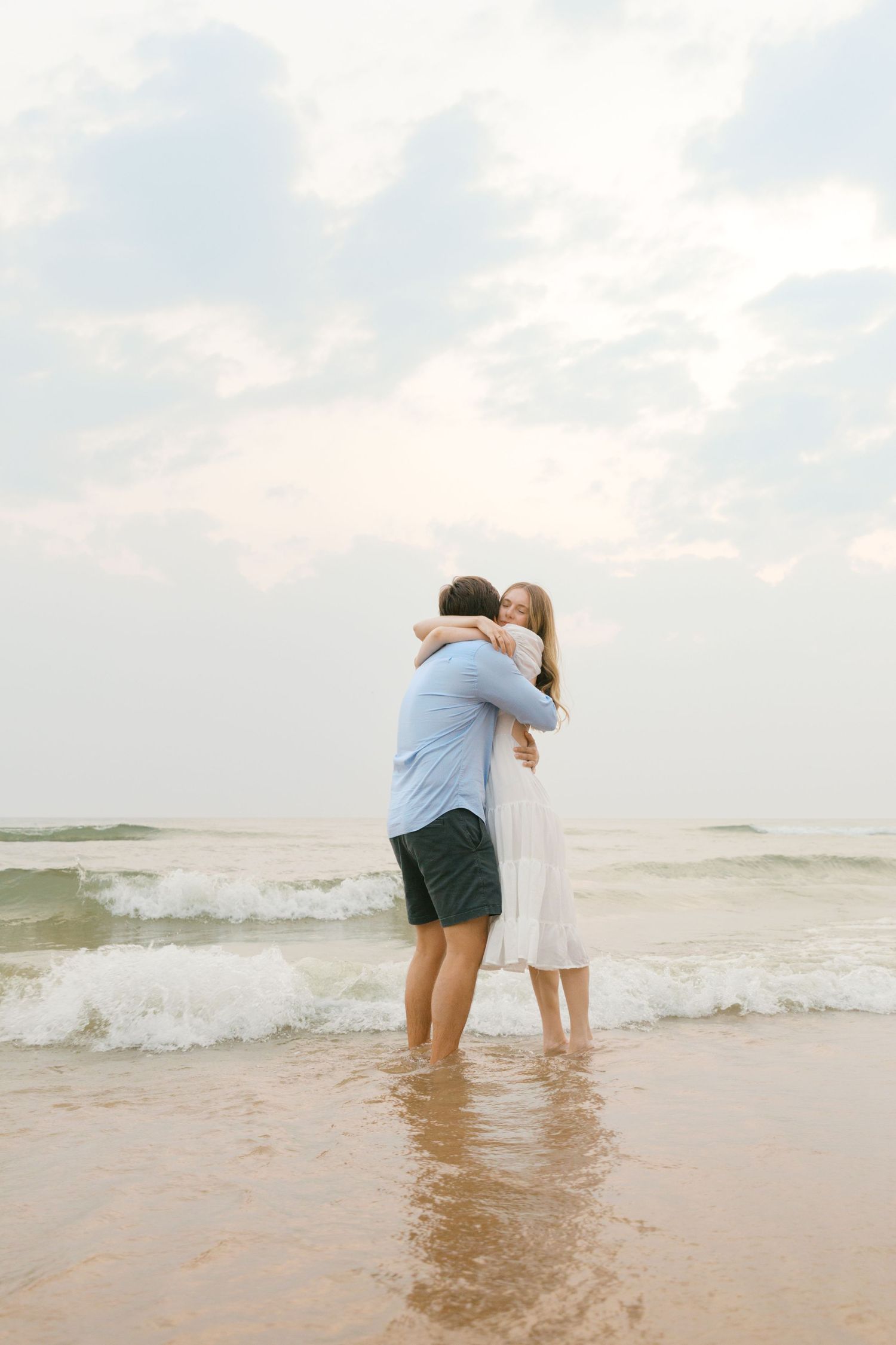 Grand Haven beach and boardwalk coastal midwest town on lake michigan engagement pictures during the summer Grand Haven Wedding photographer