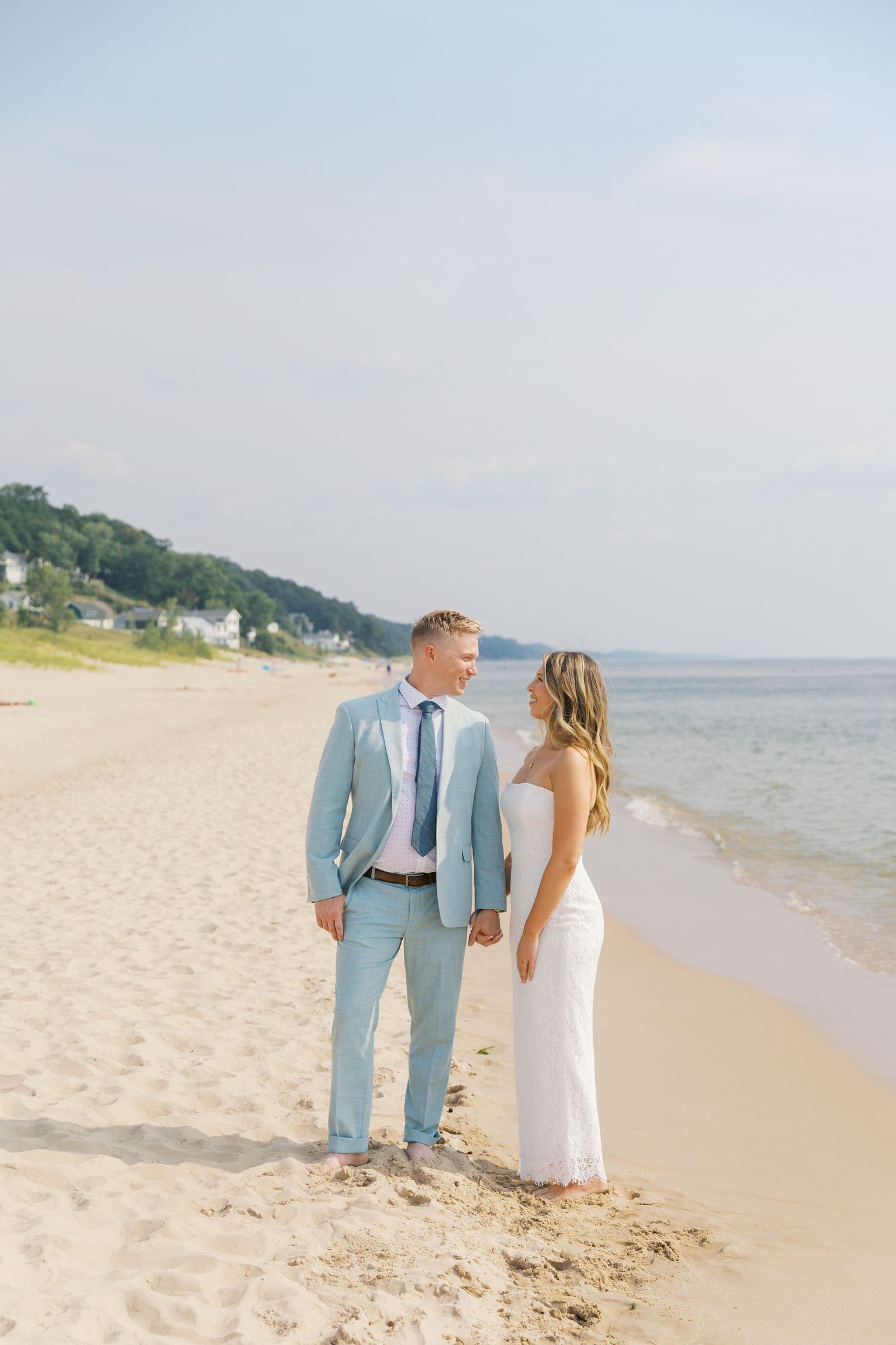 Grand Haven Michigan Elopement Photography at Grand Haven City Beach on Lake Michigan. Coastal summer elopement. From, Rayna Photography