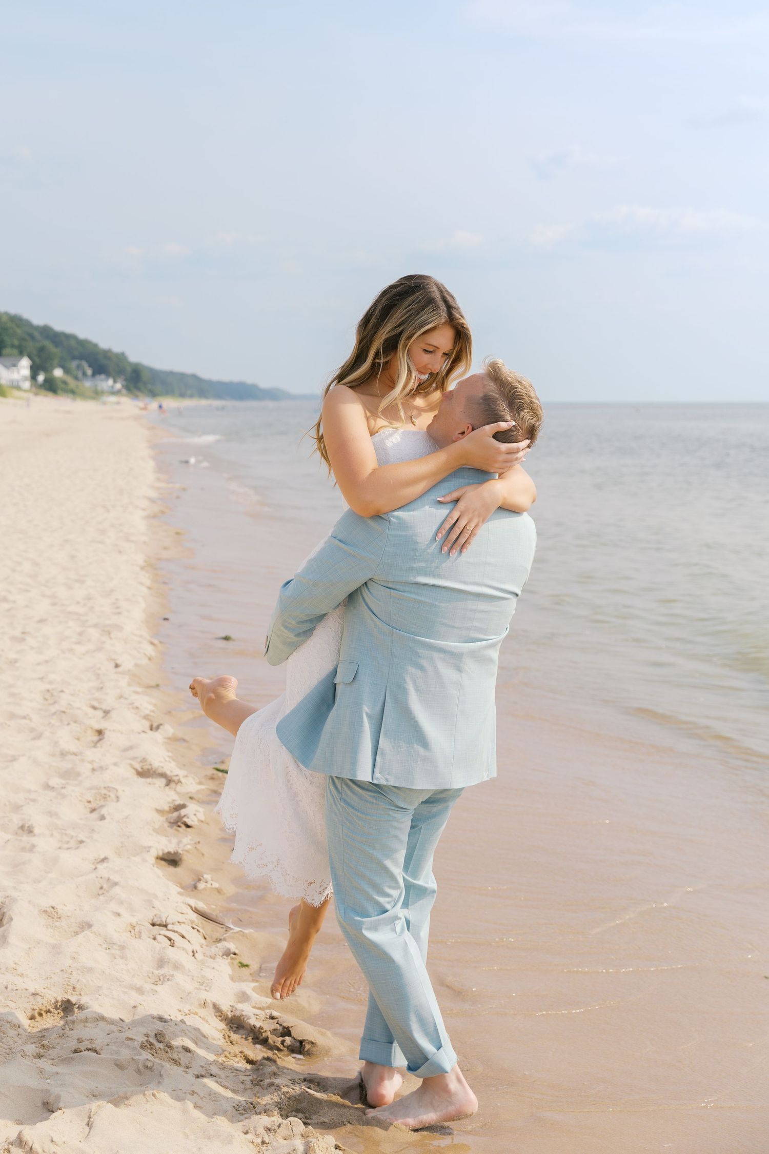 Grand Haven Michigan Elopement Photography at Grand Haven City Beach on Lake Michigan. Coastal summer elopement. From, Rayna Photography