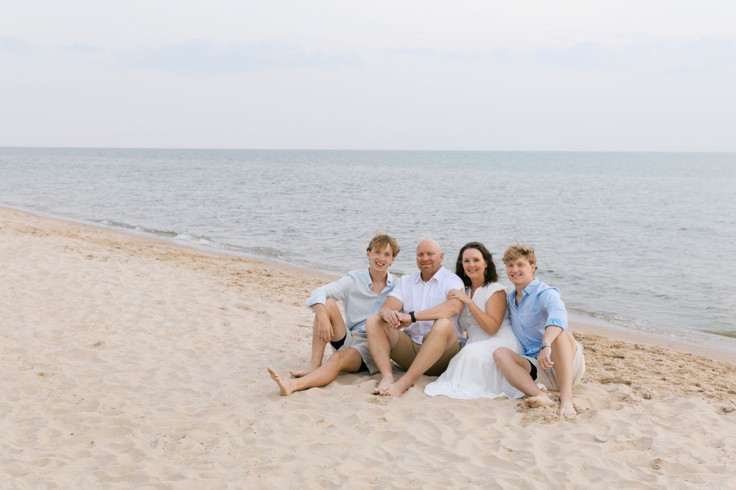 Grand Haven Summer Beach Family Pictures Lake Michigan. West Michigan Family Photographer Blue and white beach family outfit inspiration