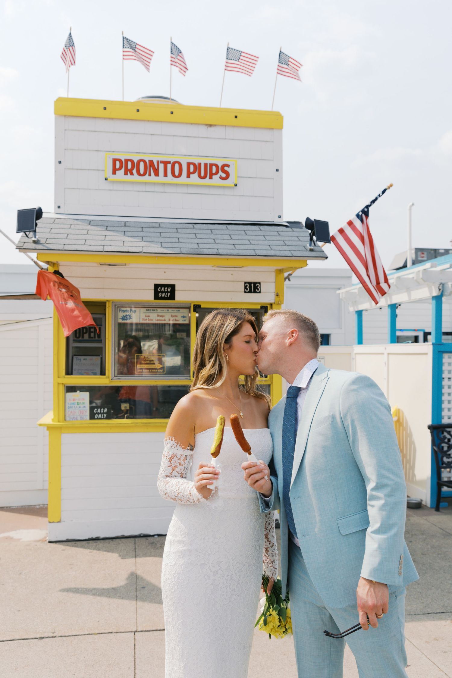 Grand Haven Michigan Elopement Photography at Pronto Pups corndog stand on Harbor Dr. Coastal summer elopement. From, Rayna Photography