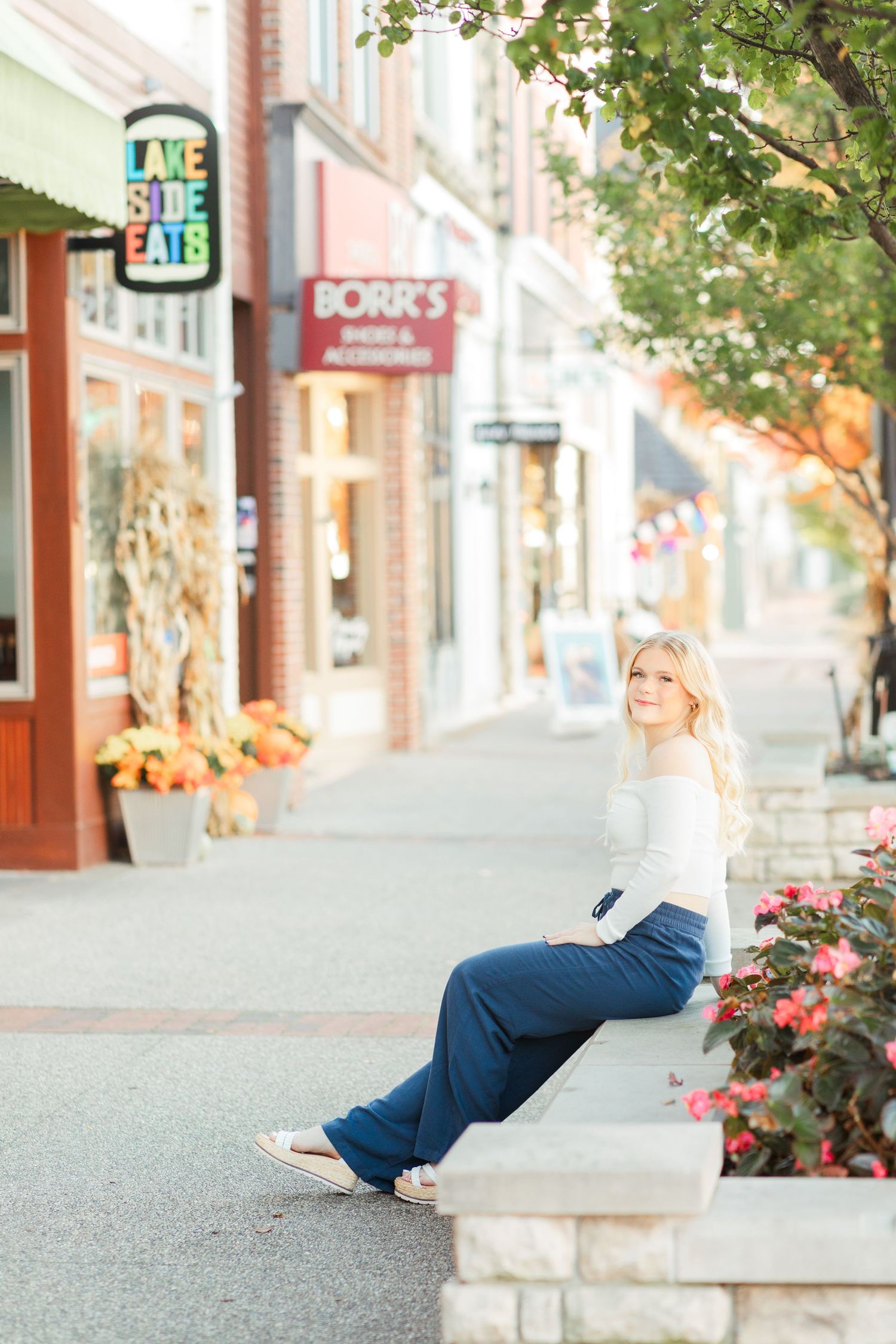 Senior Portrait Photography Pictures in downtown Grand Haven Michigan on washington street with the marquee sign