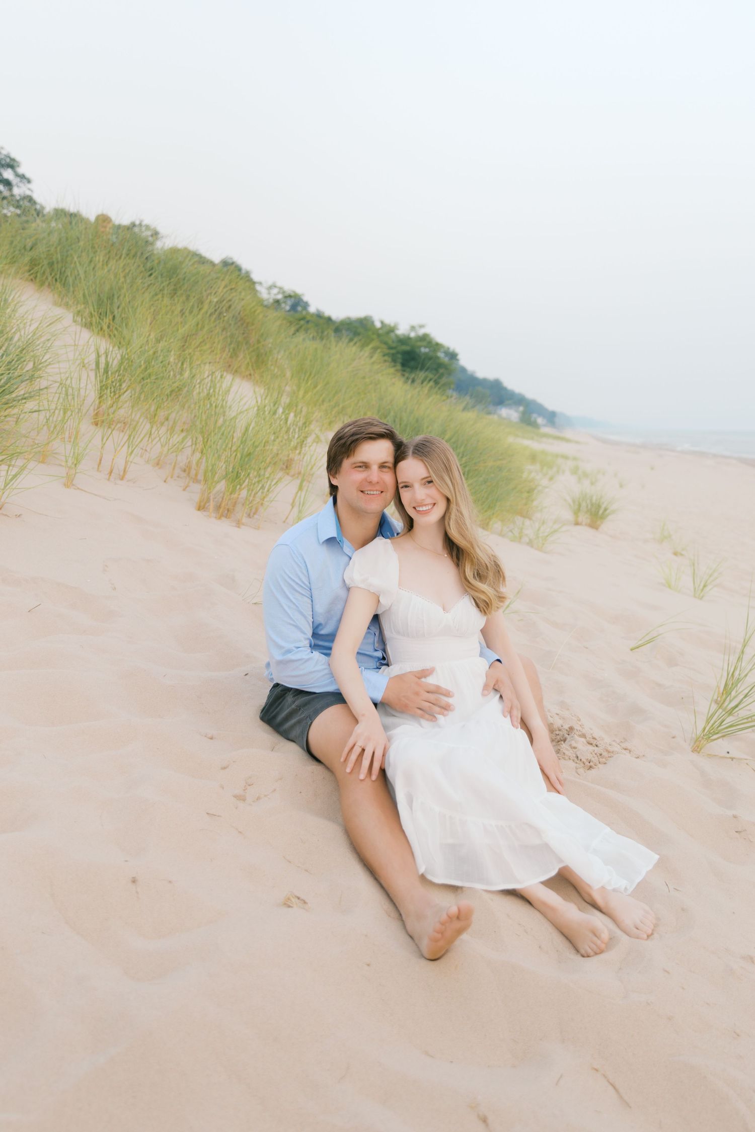 Grand Haven beach and boardwalk coastal midwest town on lake michigan engagement pictures during the summer Grand Haven Wedding photographer