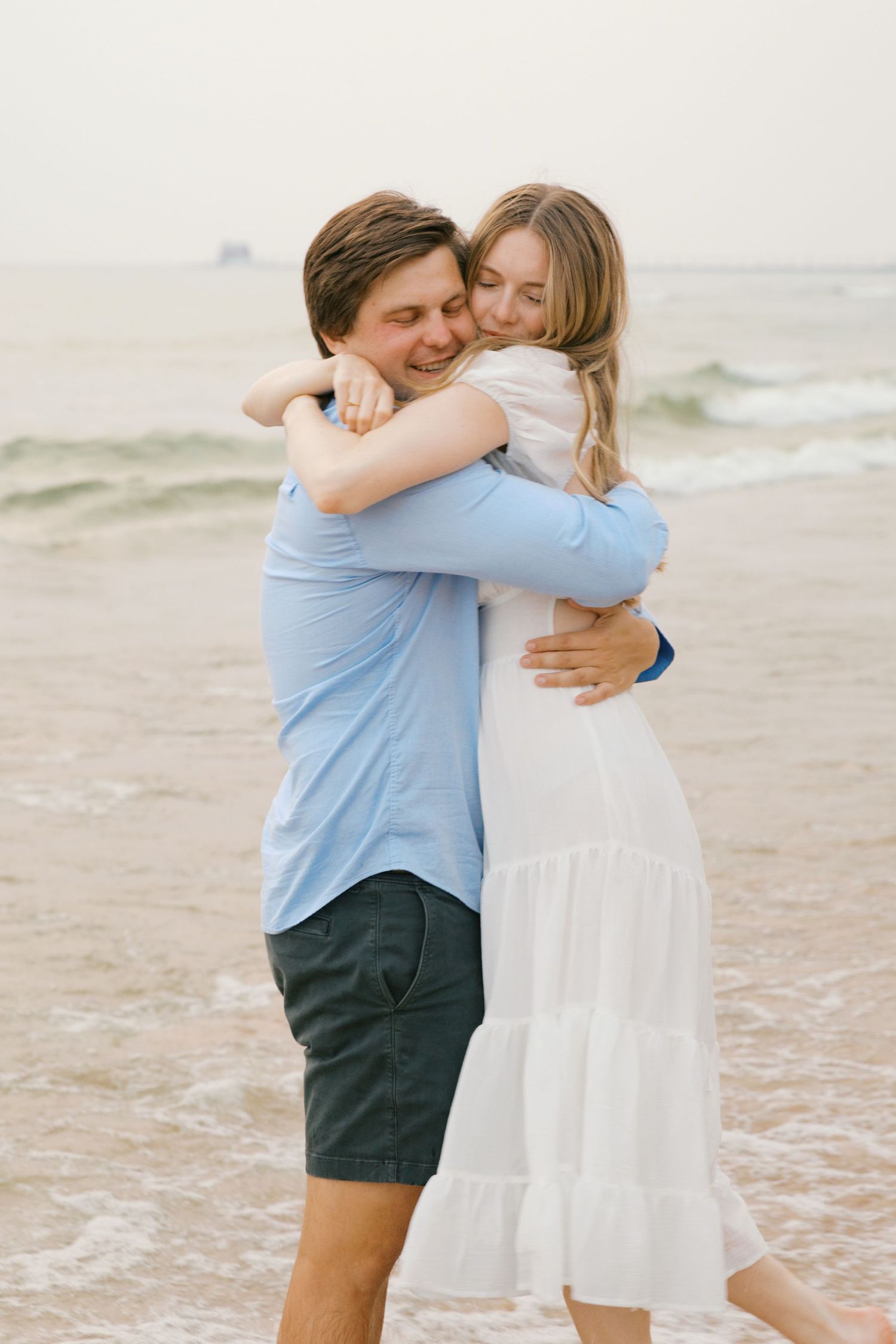 Grand Haven beach and boardwalk coastal midwest town on lake michigan engagement pictures during the summer Grand Haven Wedding photographer