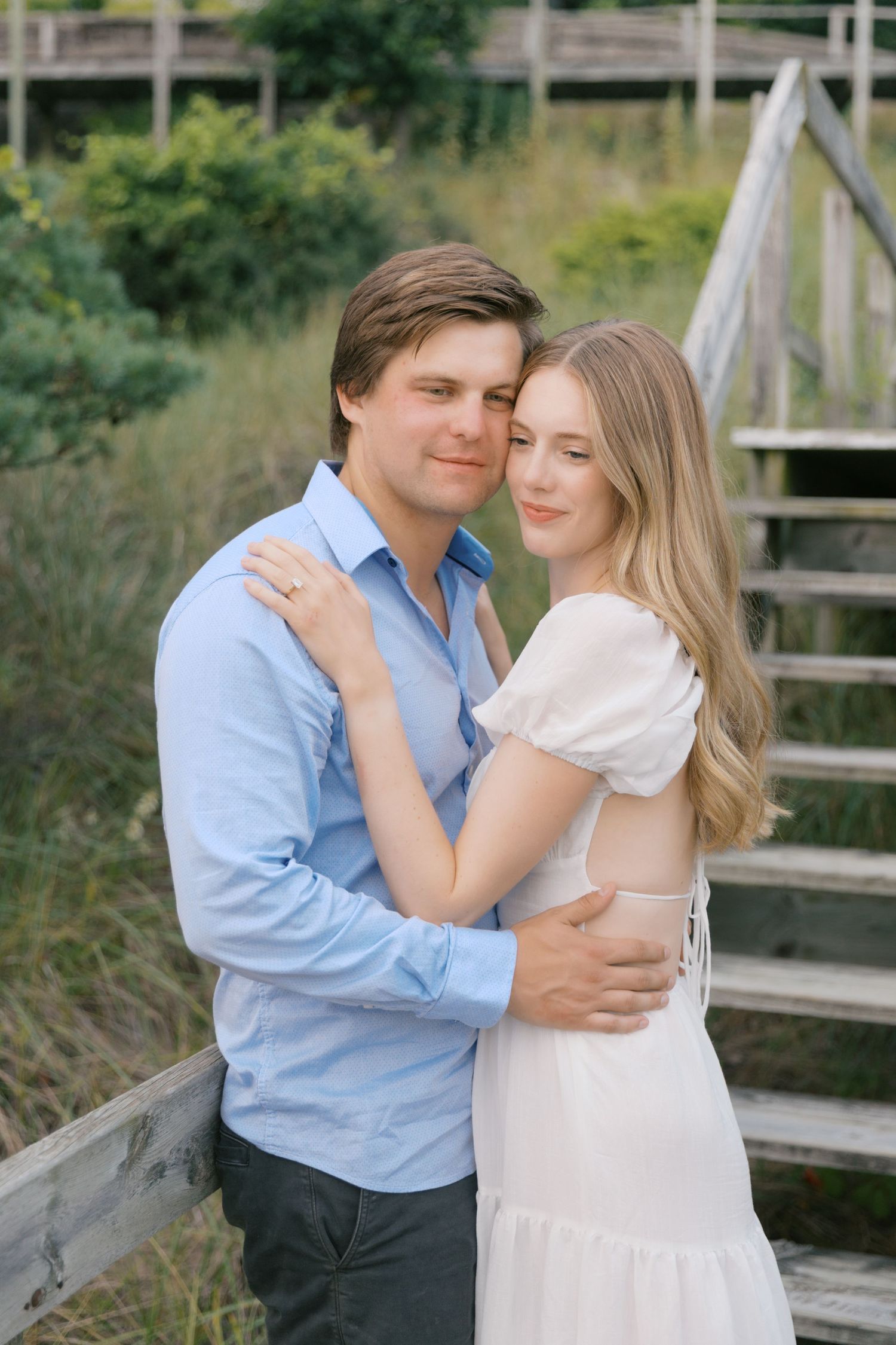 Grand Haven beach and boardwalk coastal midwest town on lake michigan engagement pictures during the summer Grand Haven Wedding photographer