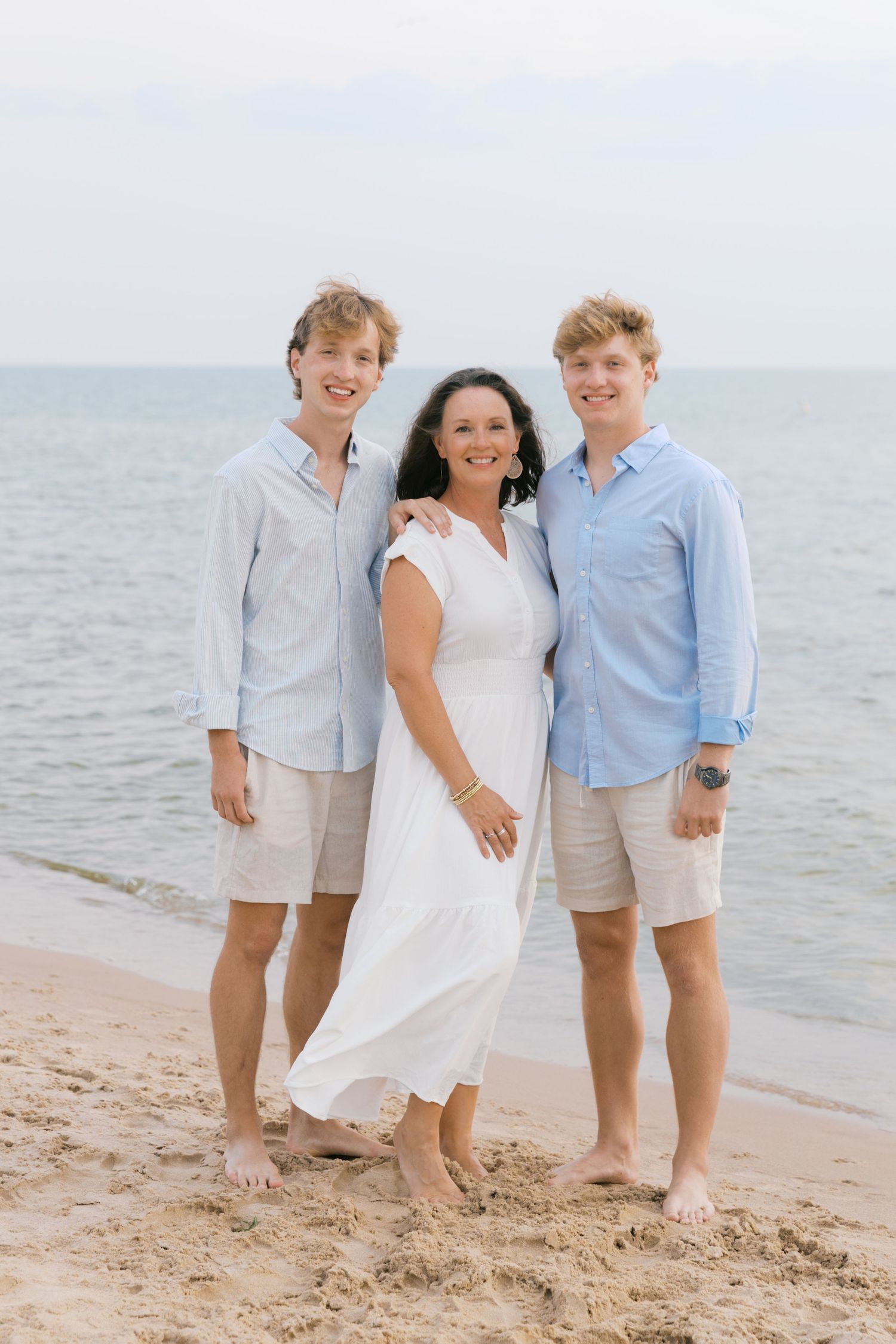 Grand Haven Summer Beach Family Pictures Lake Michigan. West Michigan Family Photographer Blue and white beach family outfit inspiration
