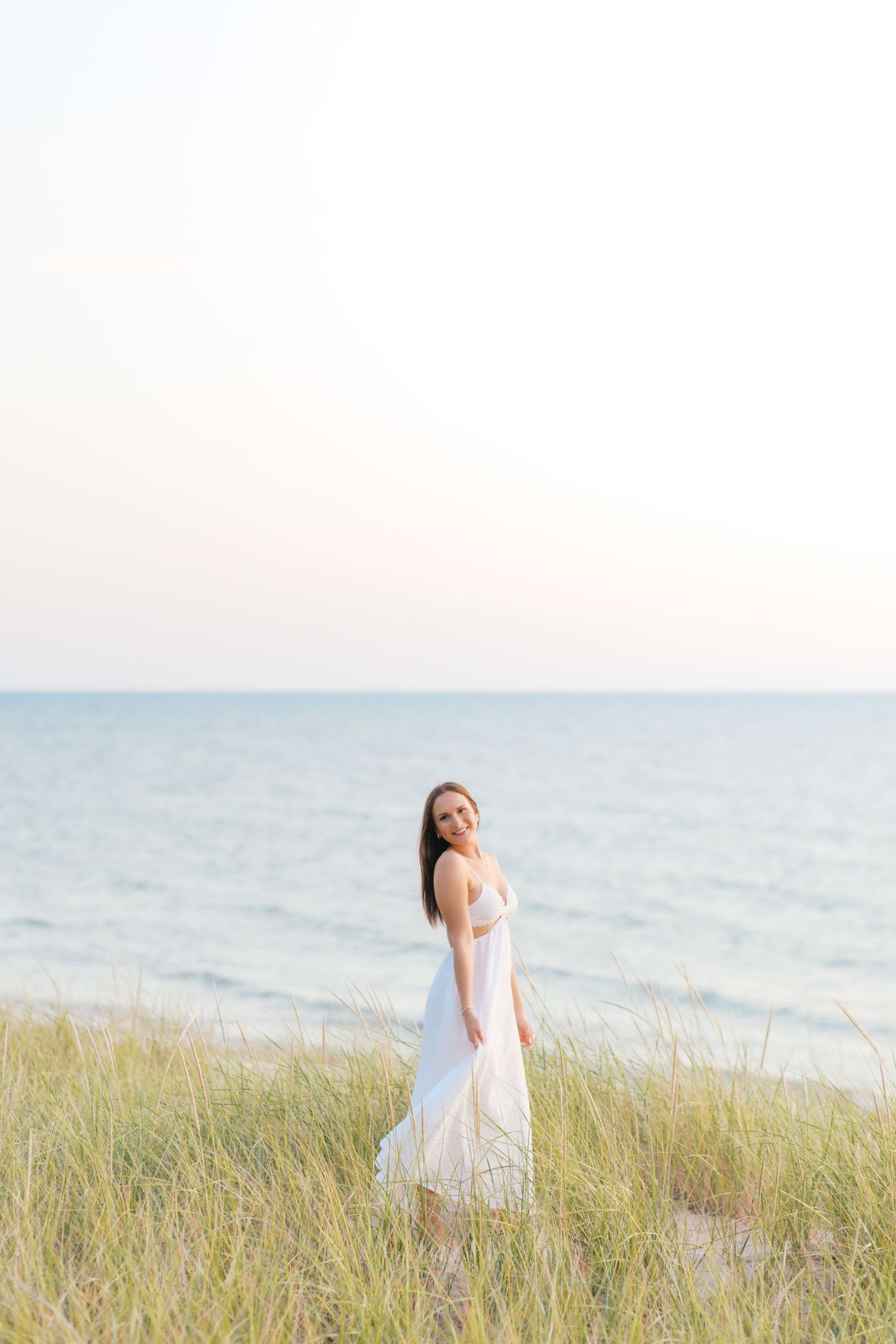 Senior Portrait Photography in Grand Haven Michigan a coastal beachtown on Lake Michigan. Beaches and downtown, sand dunes, senior year