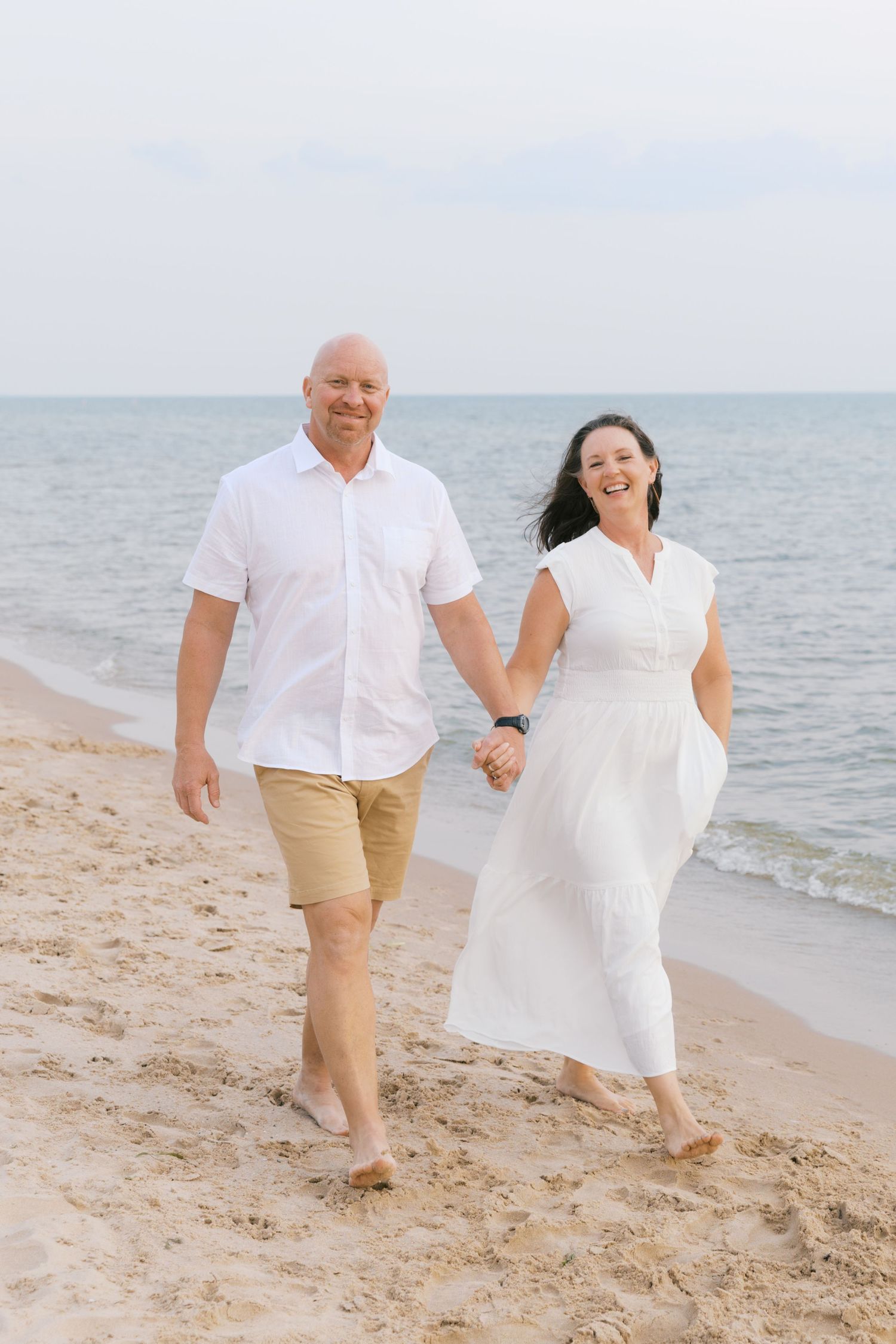 Grand Haven Summer Beach Family Pictures Lake Michigan. West Michigan Family Photographer Blue and white beach family outfit inspiration