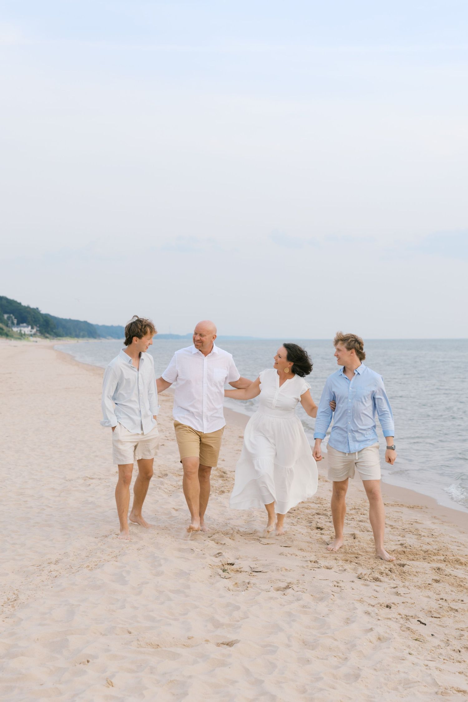 Grand Haven Summer Beach Family Pictures Lake Michigan. West Michigan Family Photographer Blue and white beach family outfit inspiration