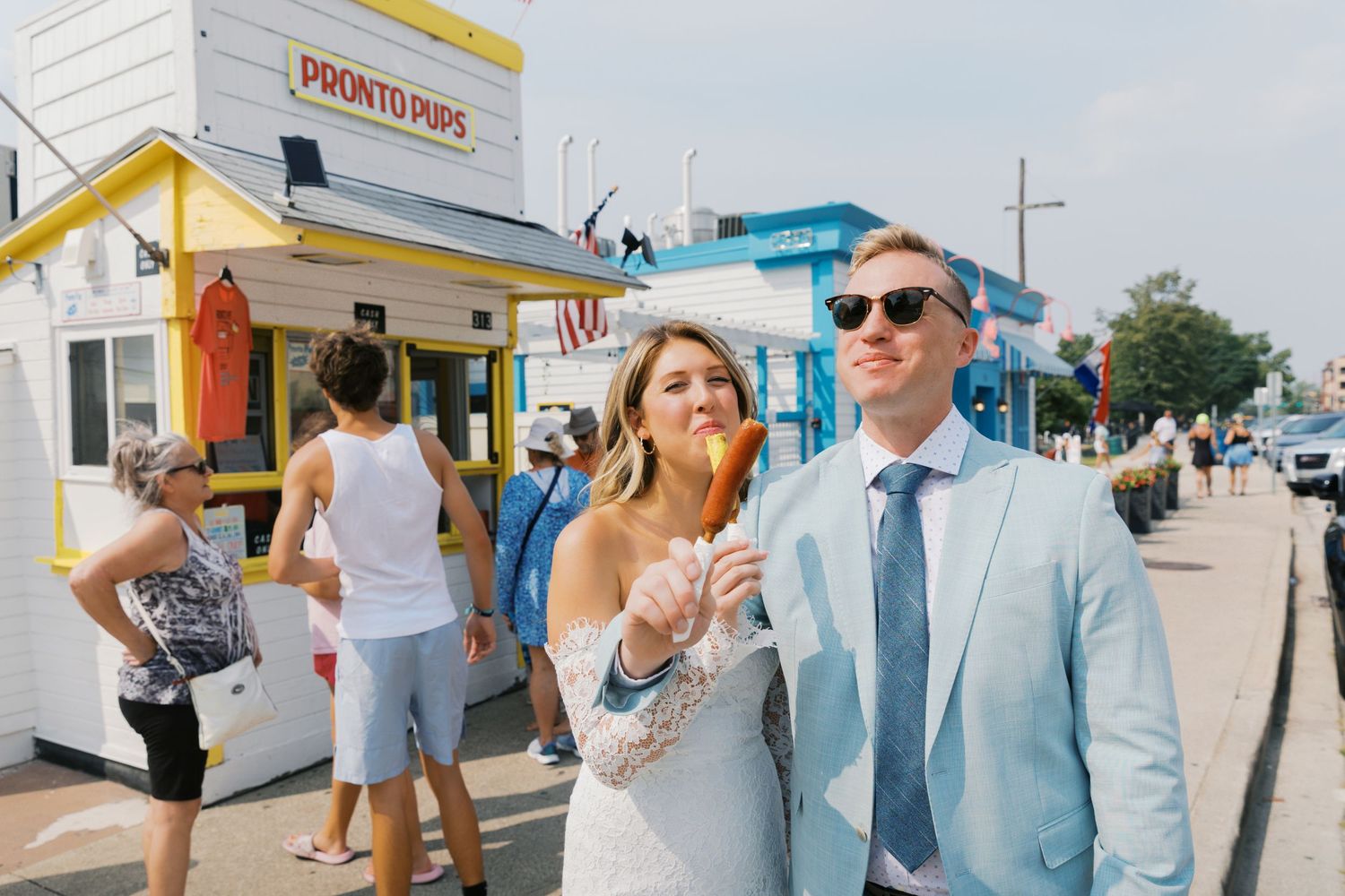 Grand Haven Michigan Elopement Photography at Pronto Pups corndog stand on Harbor Dr. Coastal summer elopement. From, Rayna Photography