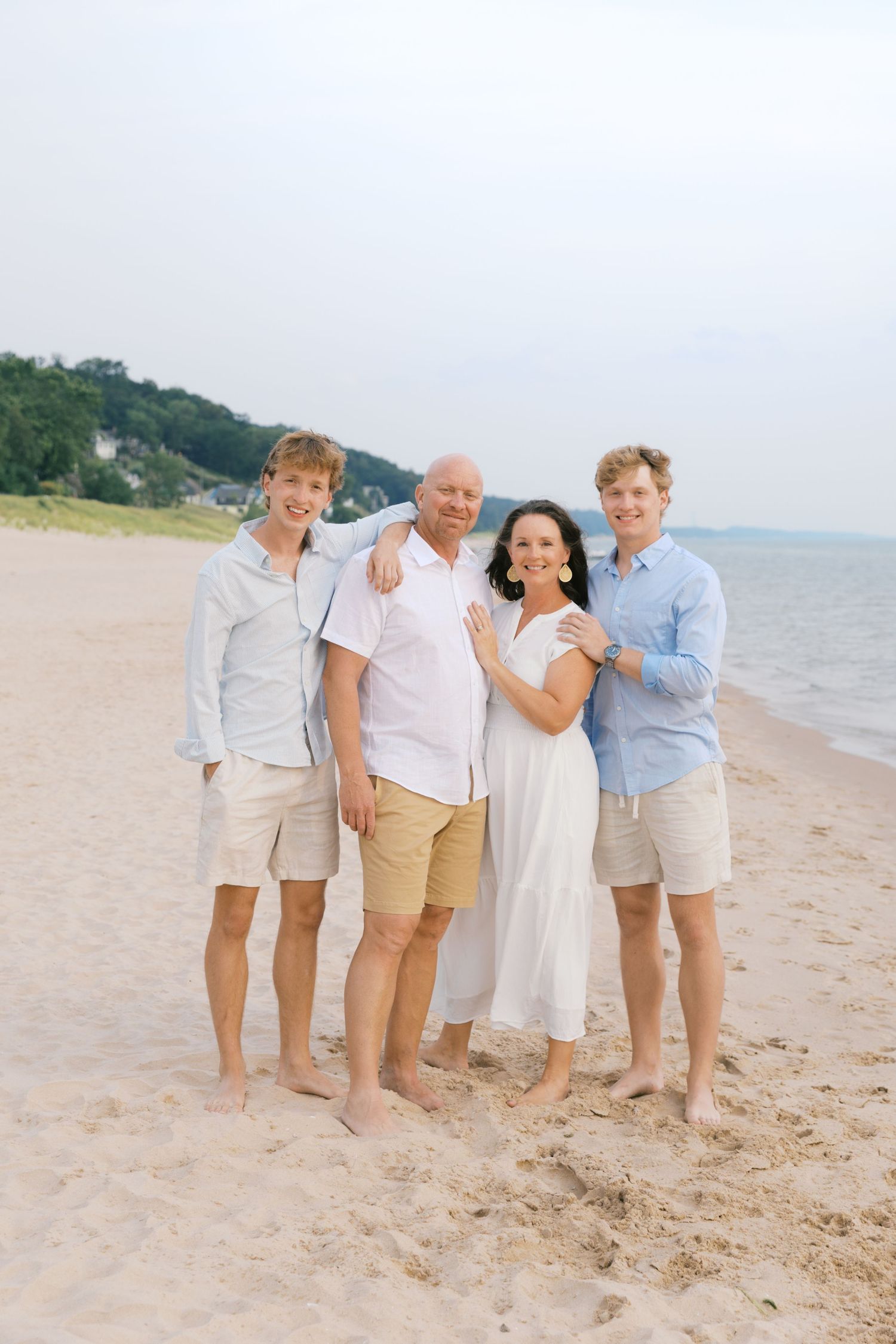 Grand Haven Summer Beach Family Pictures Lake Michigan. West Michigan Family Photographer Blue and white beach family outfit inspiration