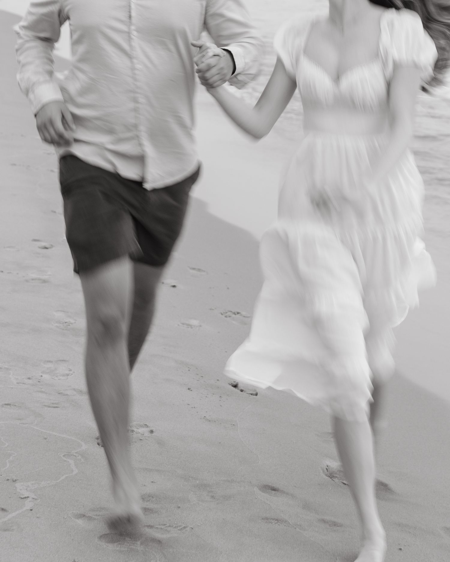 Grand Haven beach and boardwalk coastal midwest town on lake michigan engagement pictures during the summer Grand Haven Wedding photographer