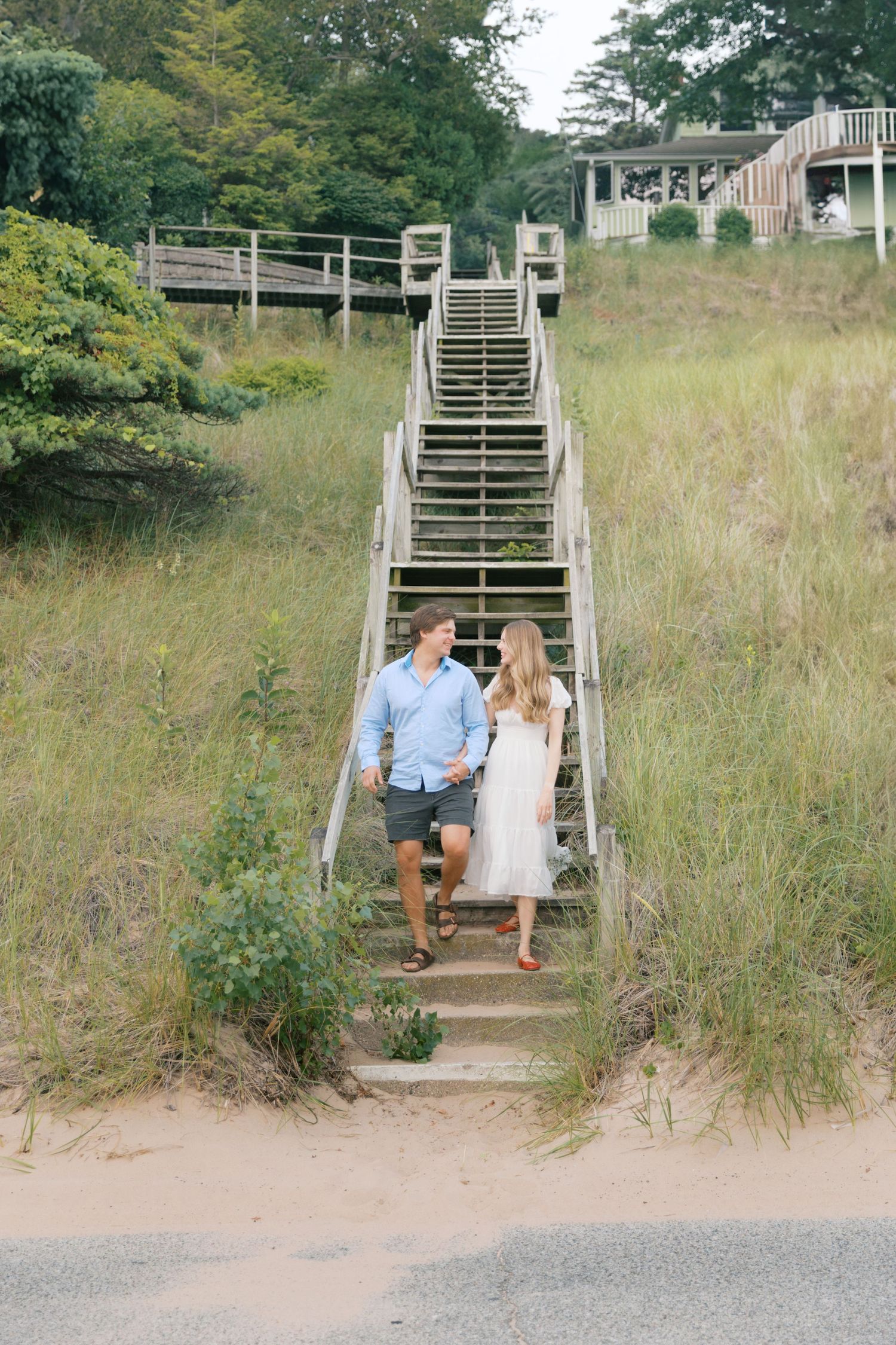 Grand Haven beach and boardwalk coastal midwest town on lake michigan engagement pictures during the summer Grand Haven Wedding photographer