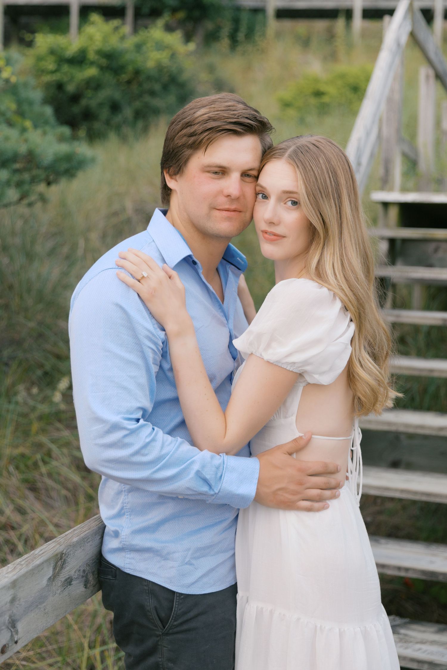 Grand Haven beach and boardwalk coastal midwest town on lake michigan engagement pictures during the summer Grand Haven Wedding photographer