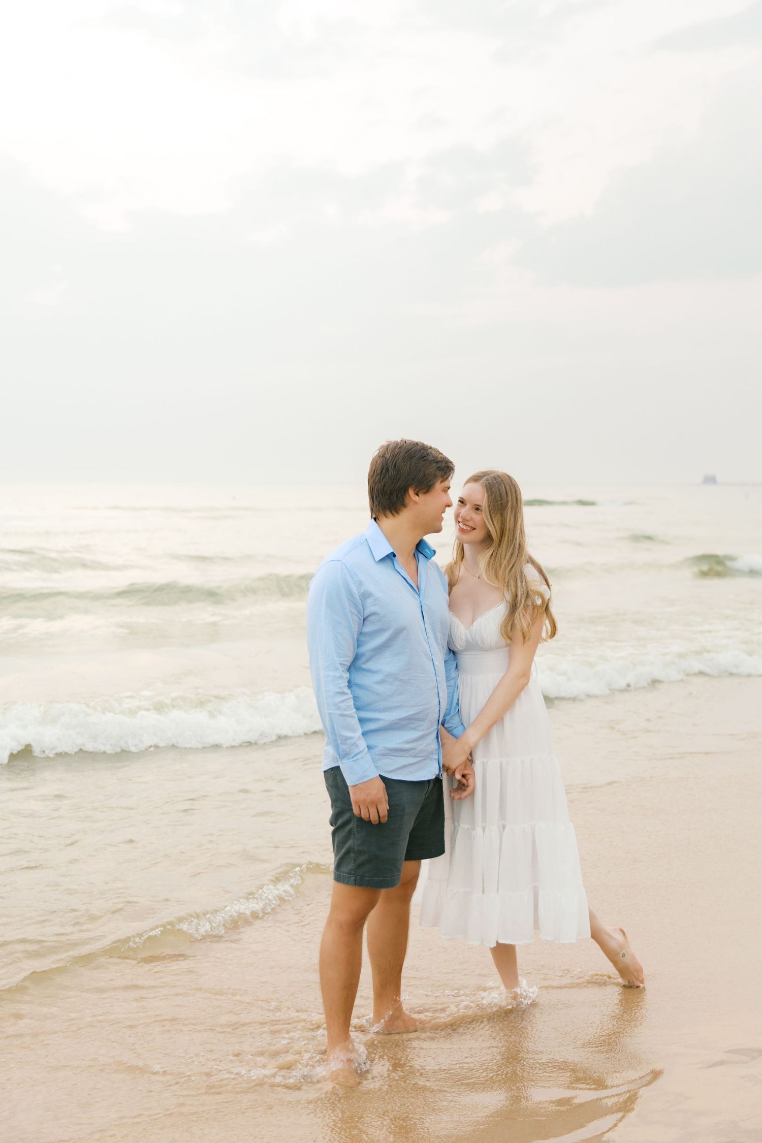 Grand Haven beach and boardwalk coastal midwest town on lake michigan engagement pictures during the summer Grand Haven Wedding photographer