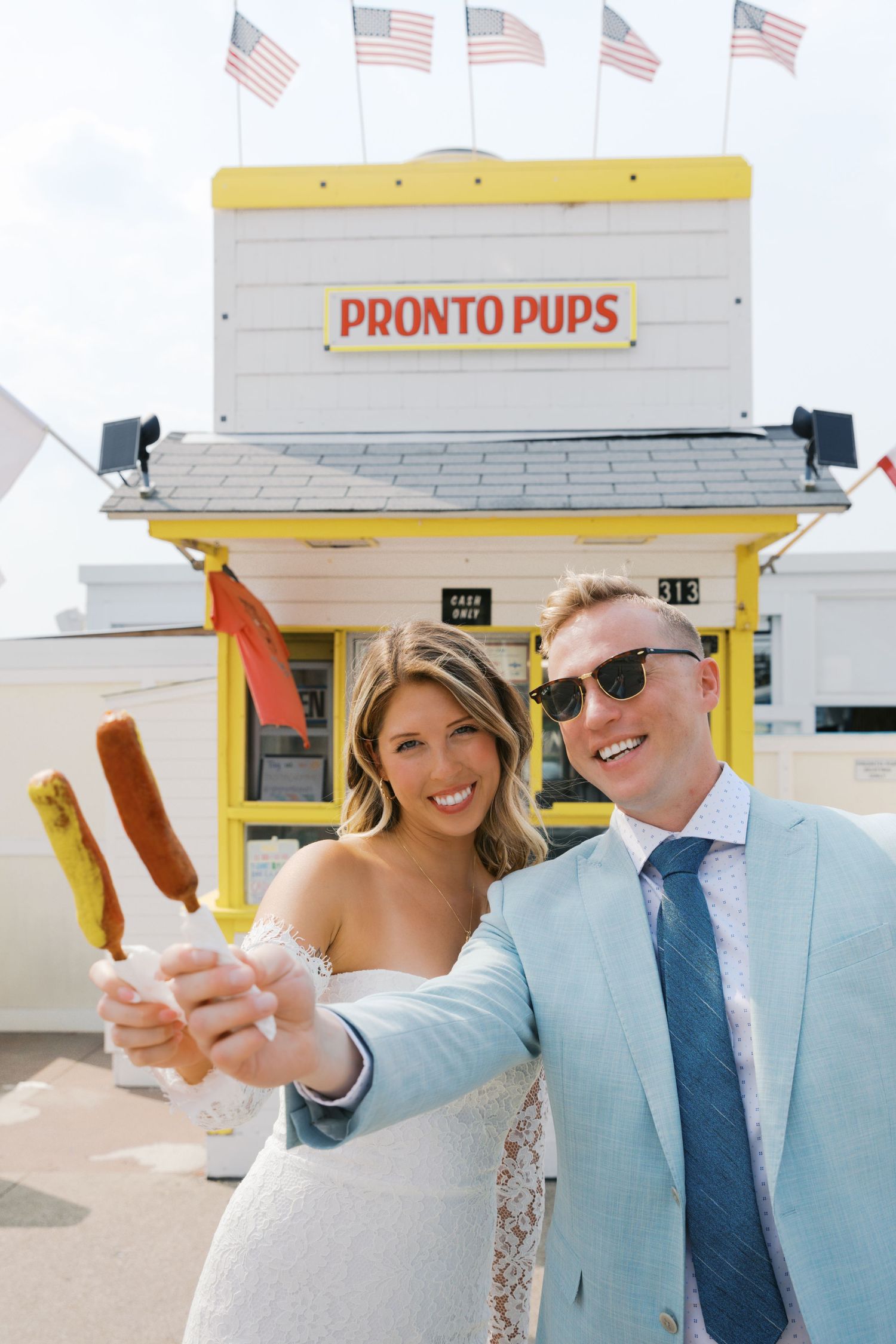 Grand Haven Michigan Elopement Photography at Pronto Pups corndog stand on Harbor Dr. Coastal summer elopement. From, Rayna Photography