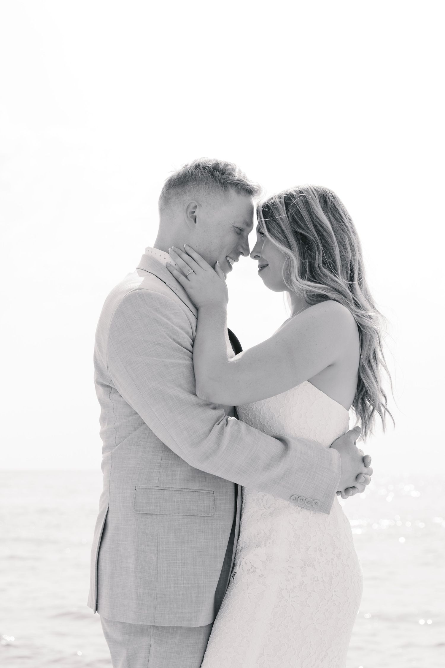 Grand Haven Michigan Elopement Photography at Grand Haven City Beach on Lake Michigan. Coastal summer elopement. From, Rayna Photography