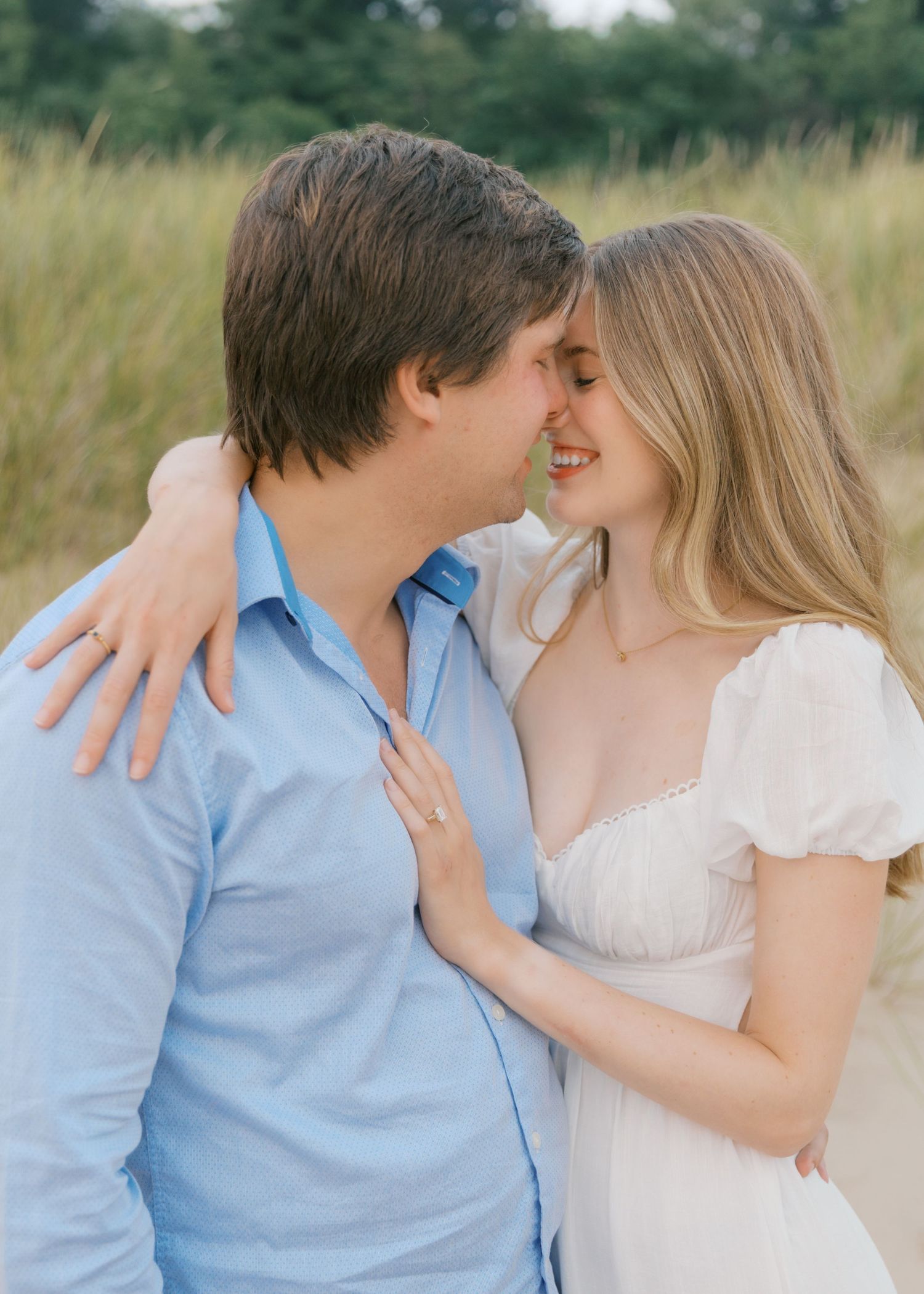 Grand Haven beach and boardwalk coastal midwest town on lake michigan engagement pictures during the summer Grand Haven Wedding photographer