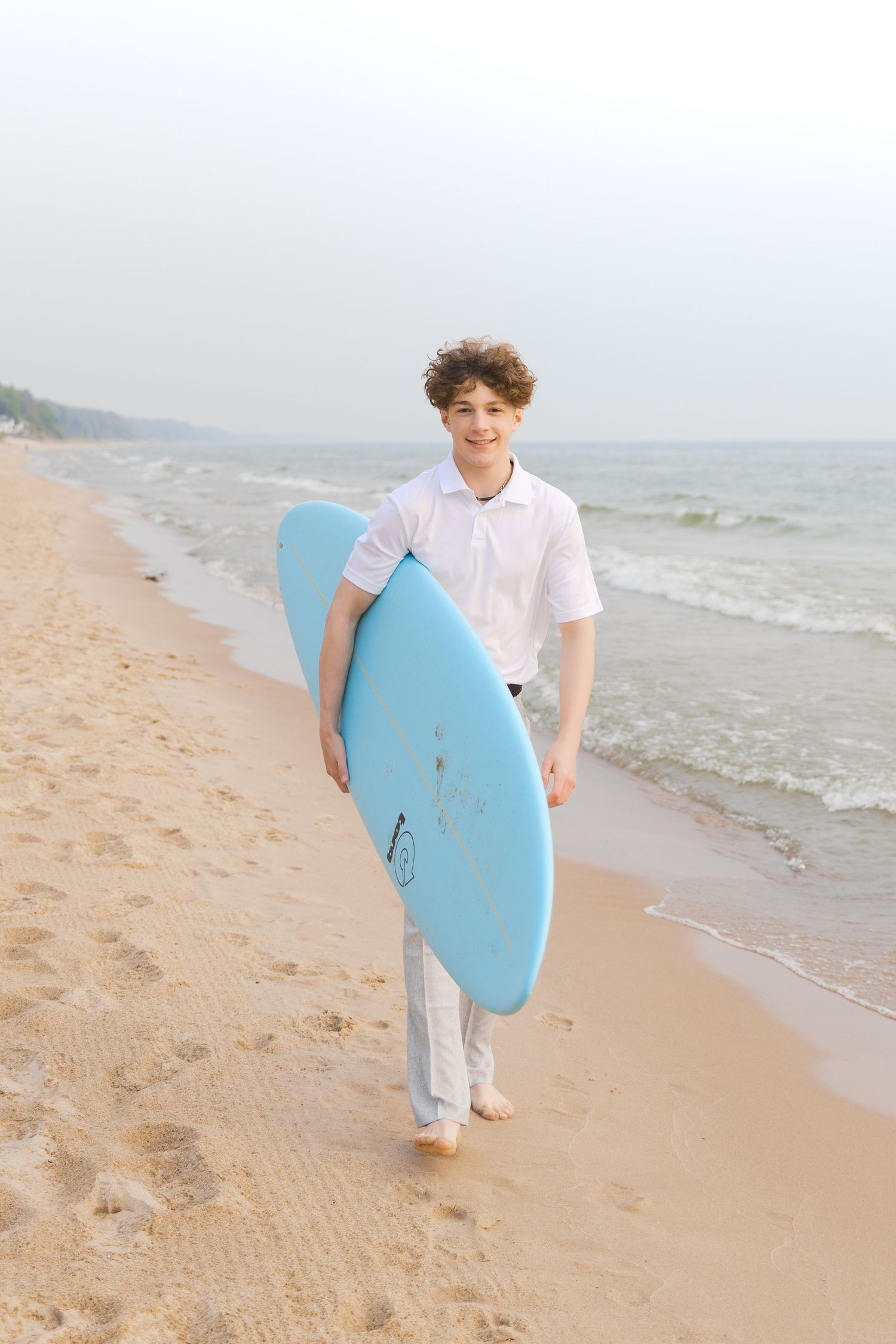 Senior Portrait Photography in Grand Haven Michigan a coastal beachtown on Lake Michigan. Beaches and downtown, sand dunes, senior year