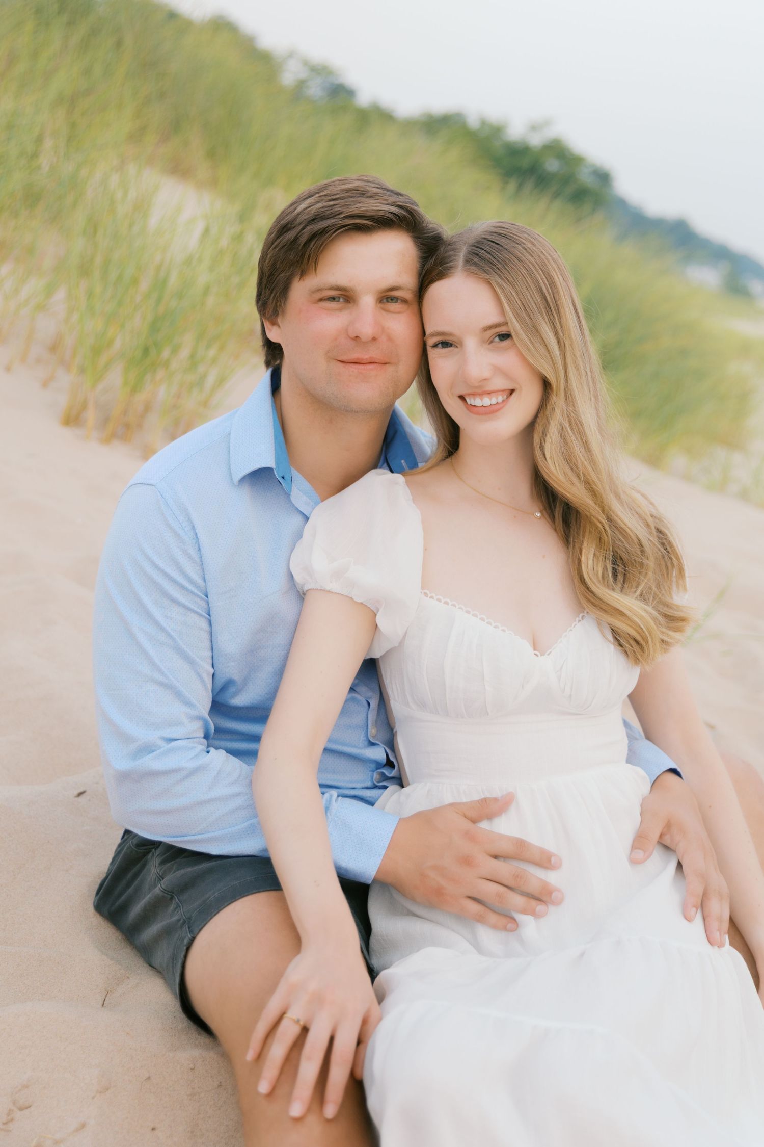 Grand Haven beach and boardwalk coastal midwest town on lake michigan engagement pictures during the summer Grand Haven Wedding photographer