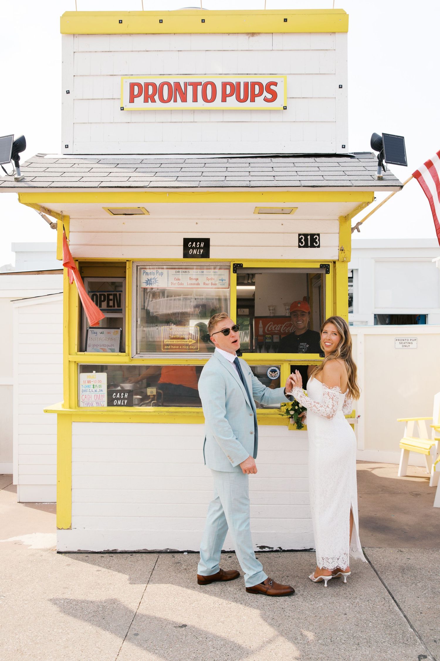 Grand Haven Michigan Elopement Photography at Pronto Pups corndog stand on Harbor Dr. Coastal summer elopement. From, Rayna Photography