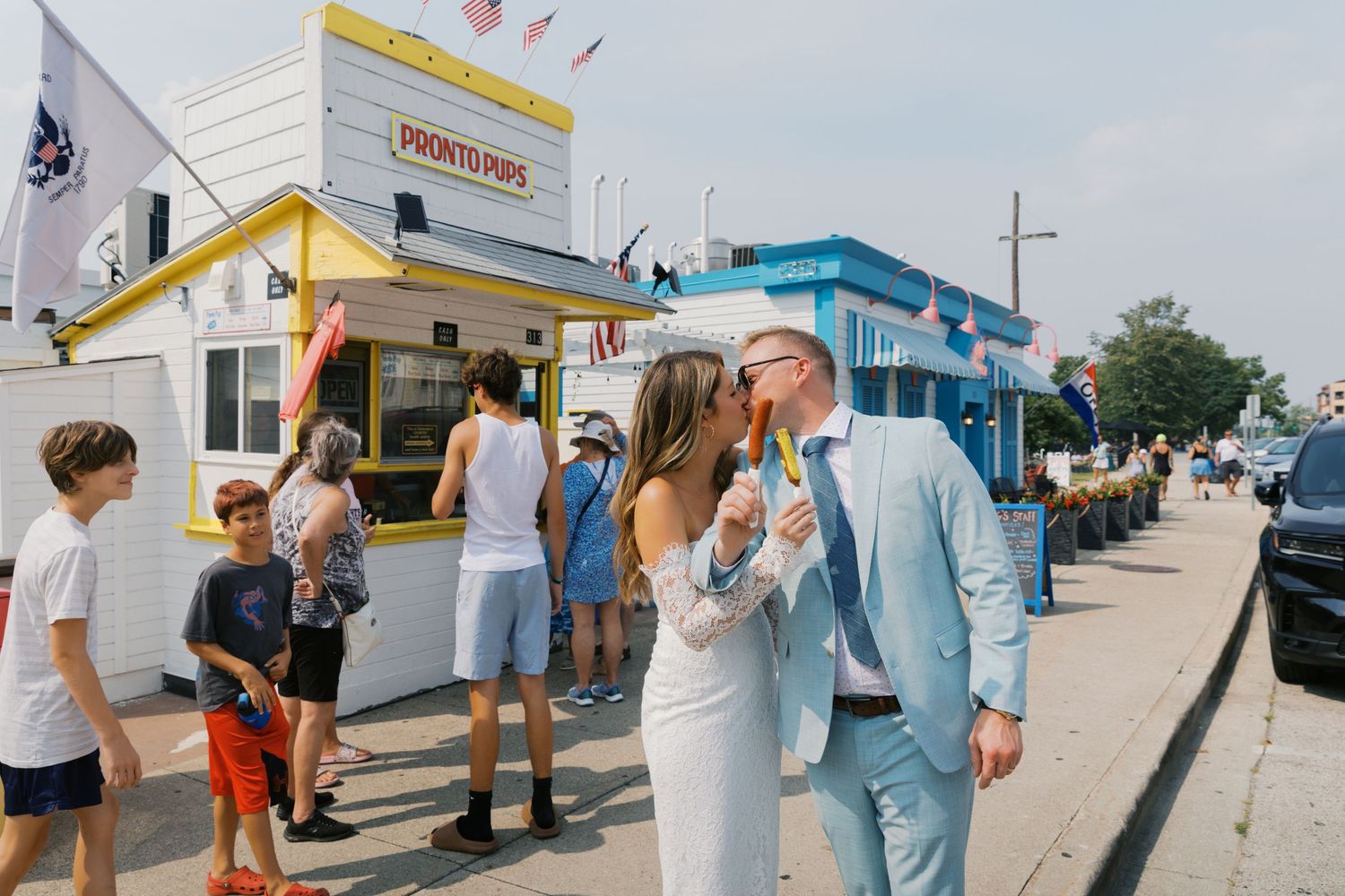 Grand Haven Michigan Elopement Photography at Pronto Pups corndog stand on Harbor Dr. Coastal summer elopement. From, Rayna Photography
