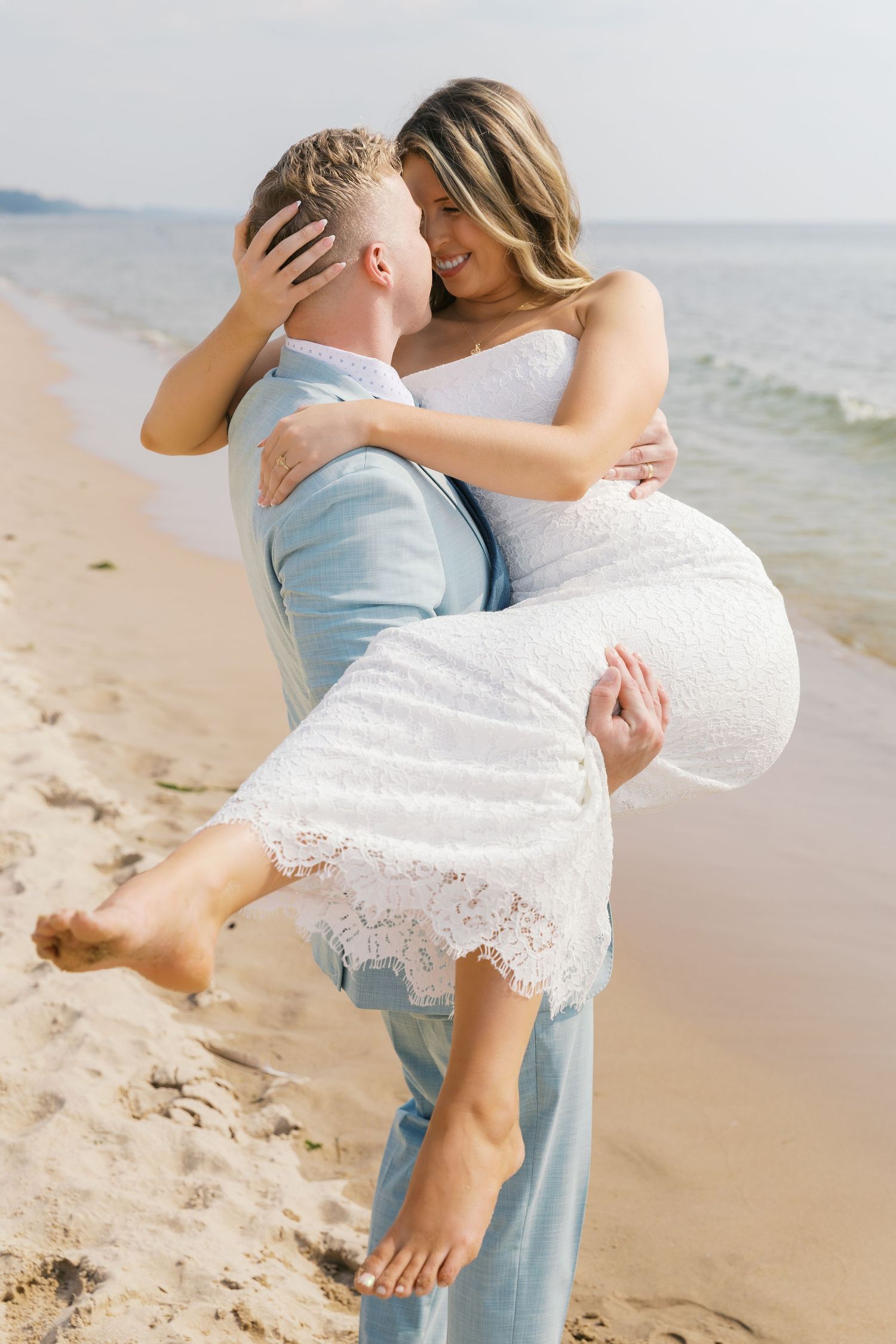 Grand Haven Michigan Elopement Photography at Grand Haven City Beach on Lake Michigan. Coastal summer elopement. From, Rayna Photography