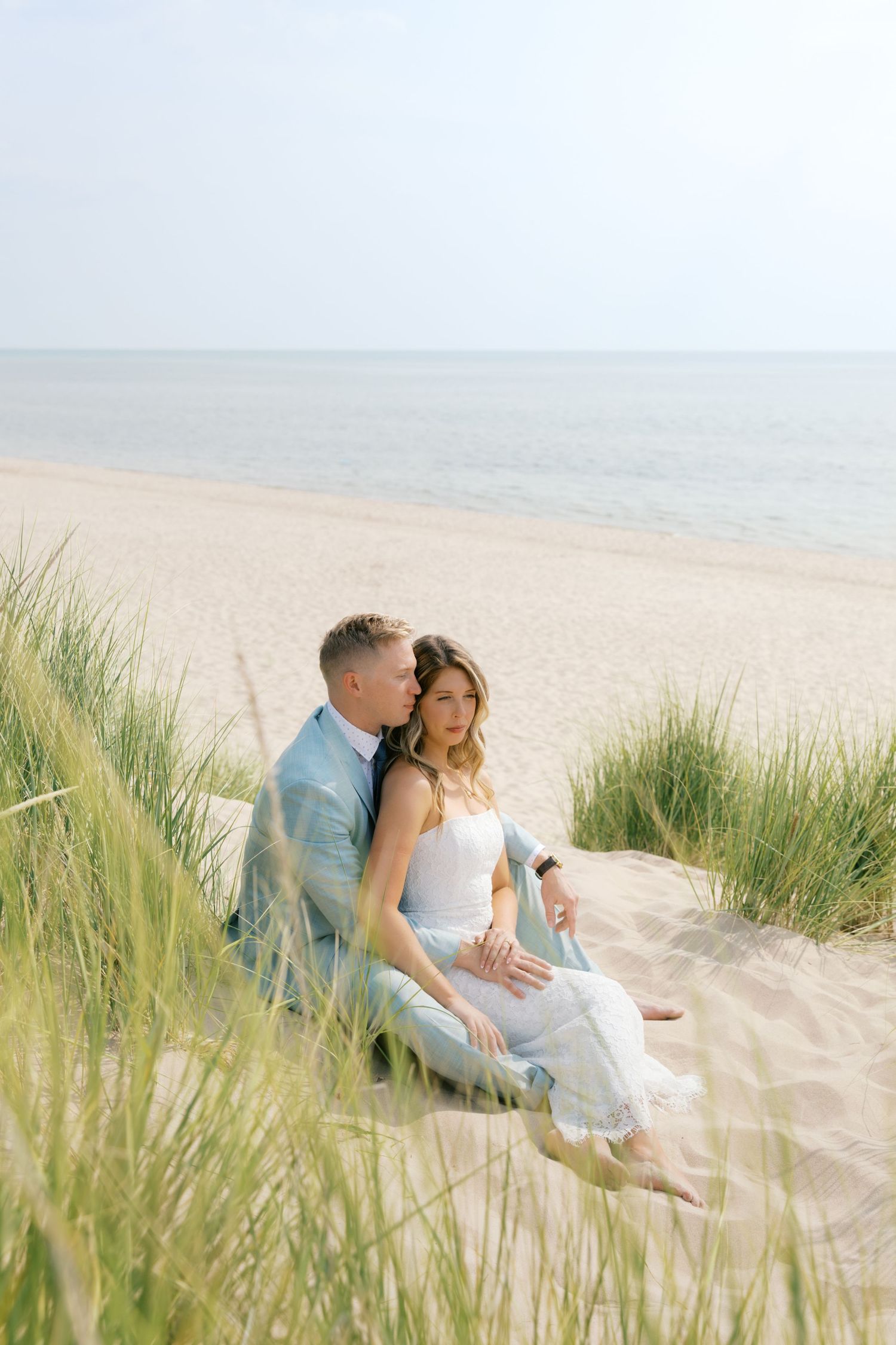 Grand Haven Michigan Elopement Photography at Grand Haven City Beach on Lake Michigan. Coastal summer elopement. From, Rayna Photography