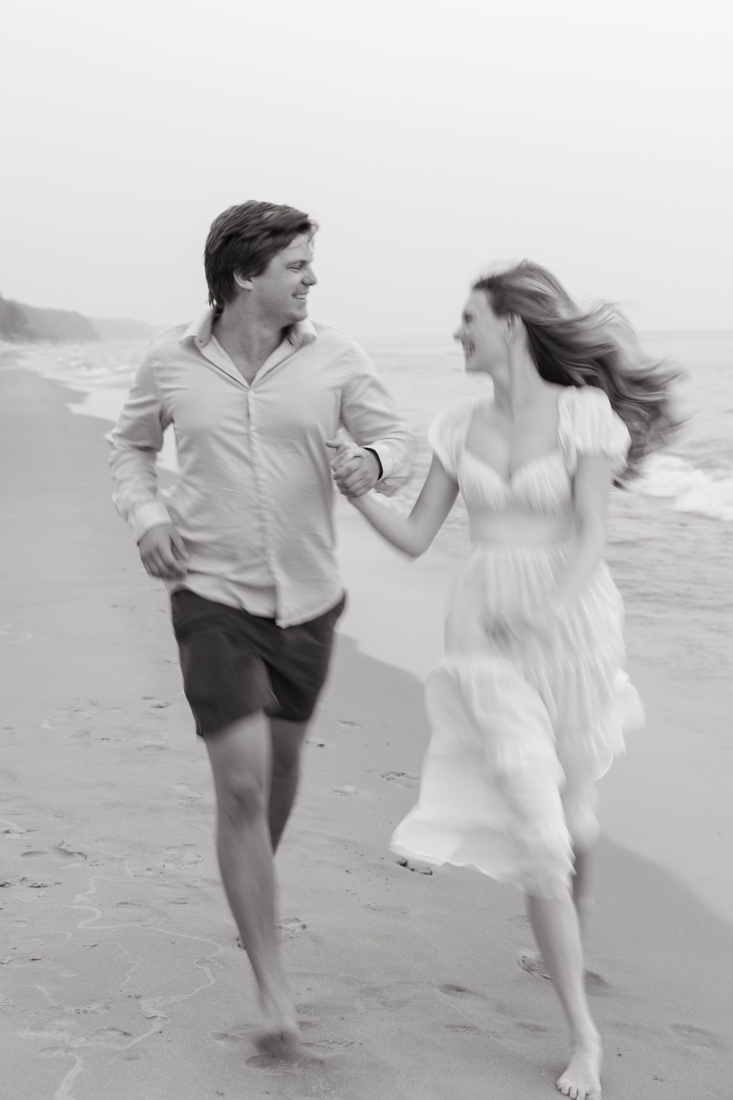 Grand Haven beach and boardwalk coastal midwest town on lake michigan engagement pictures during the summer Grand Haven Wedding photographer