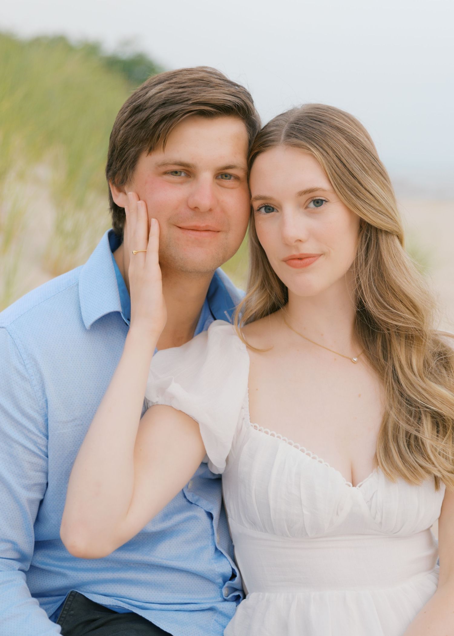 Grand Haven beach and boardwalk coastal midwest town on lake michigan engagement pictures during the summer Grand Haven Wedding photographer