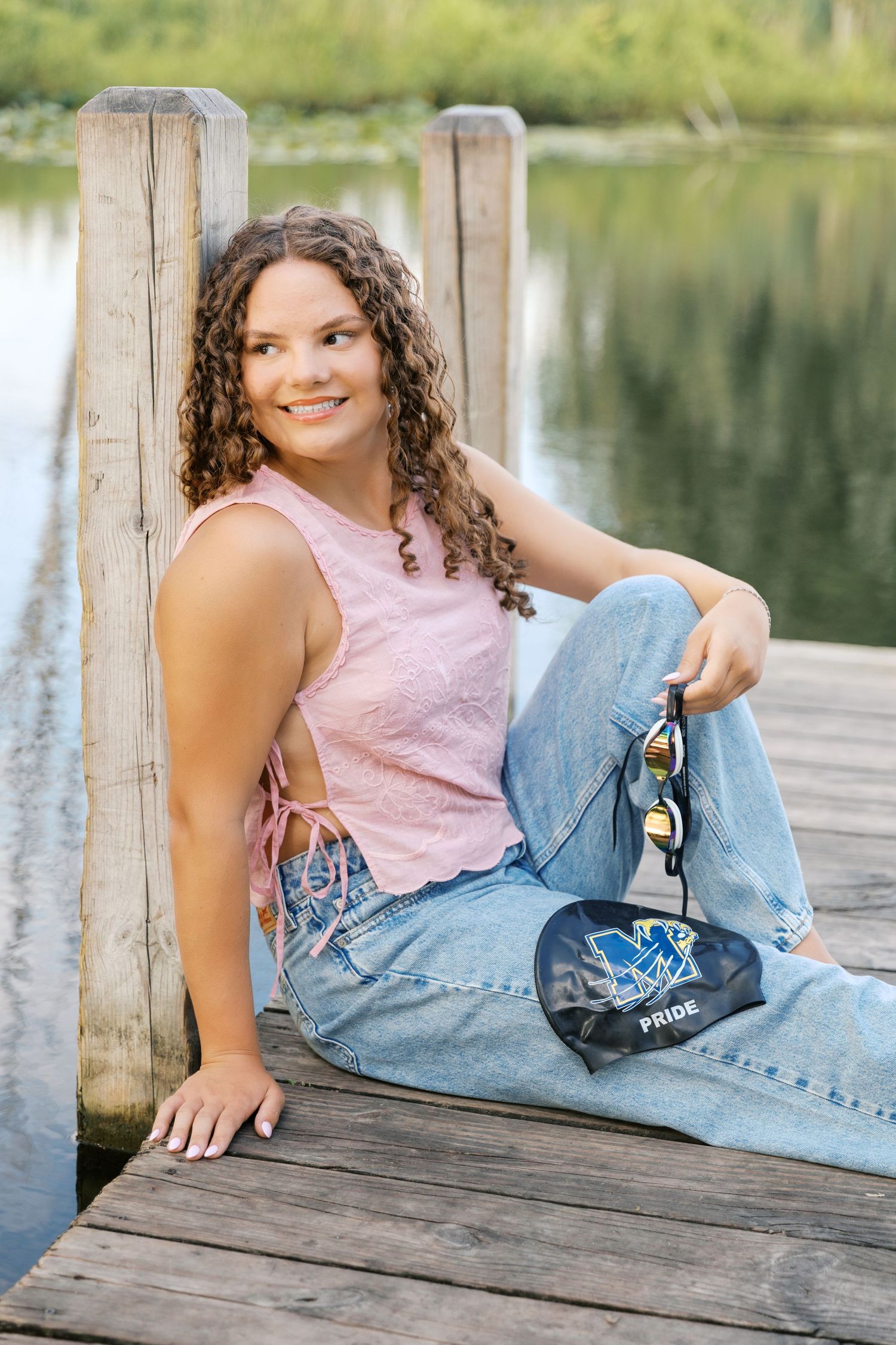Senior Portrait Photography Pictures at East Grand River Park in Grand Haven Michigan. Dock and lakeside senior pictures under a willow tree